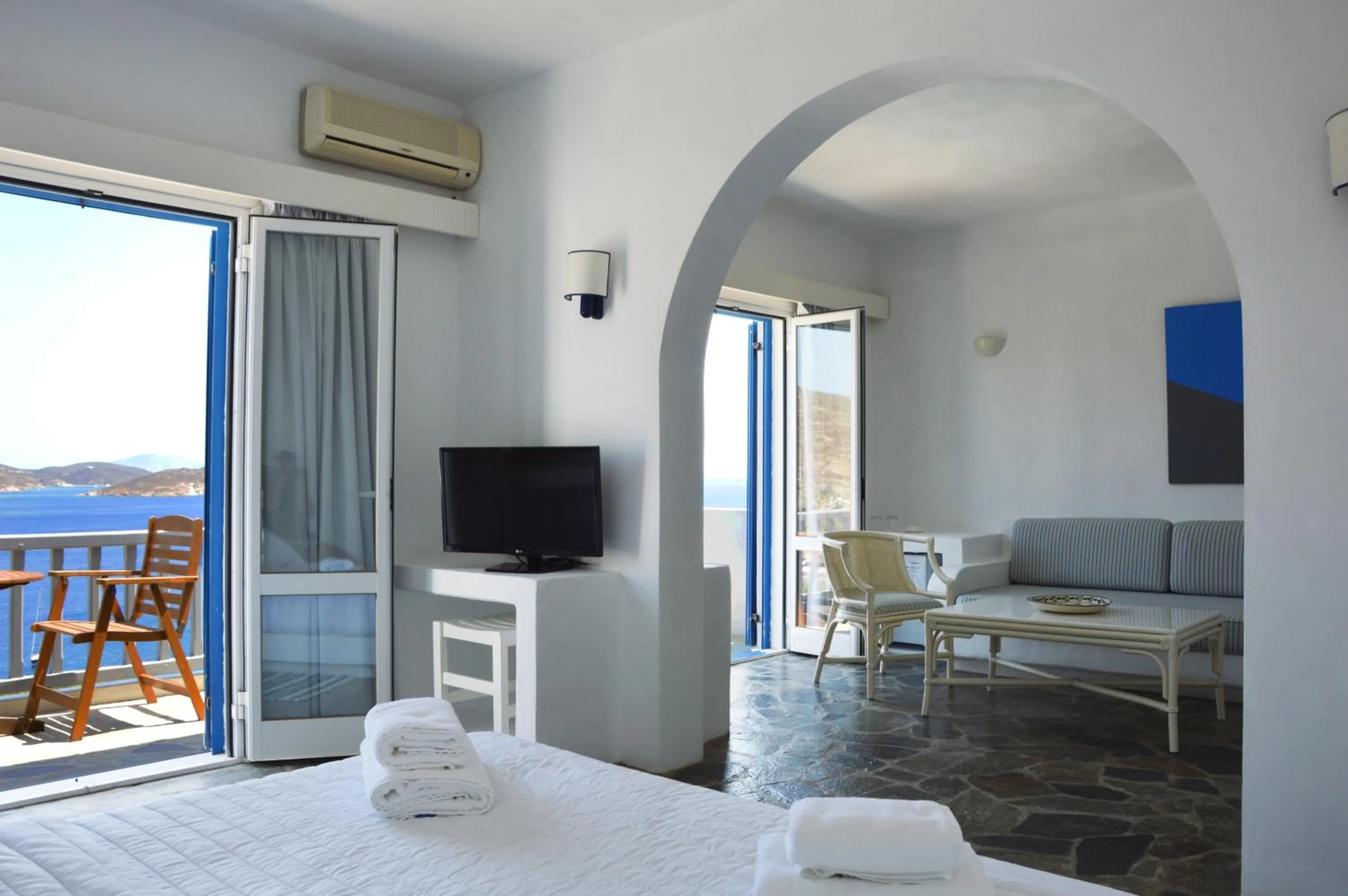 Seating area, Bed in Patmos Paradise Hotel