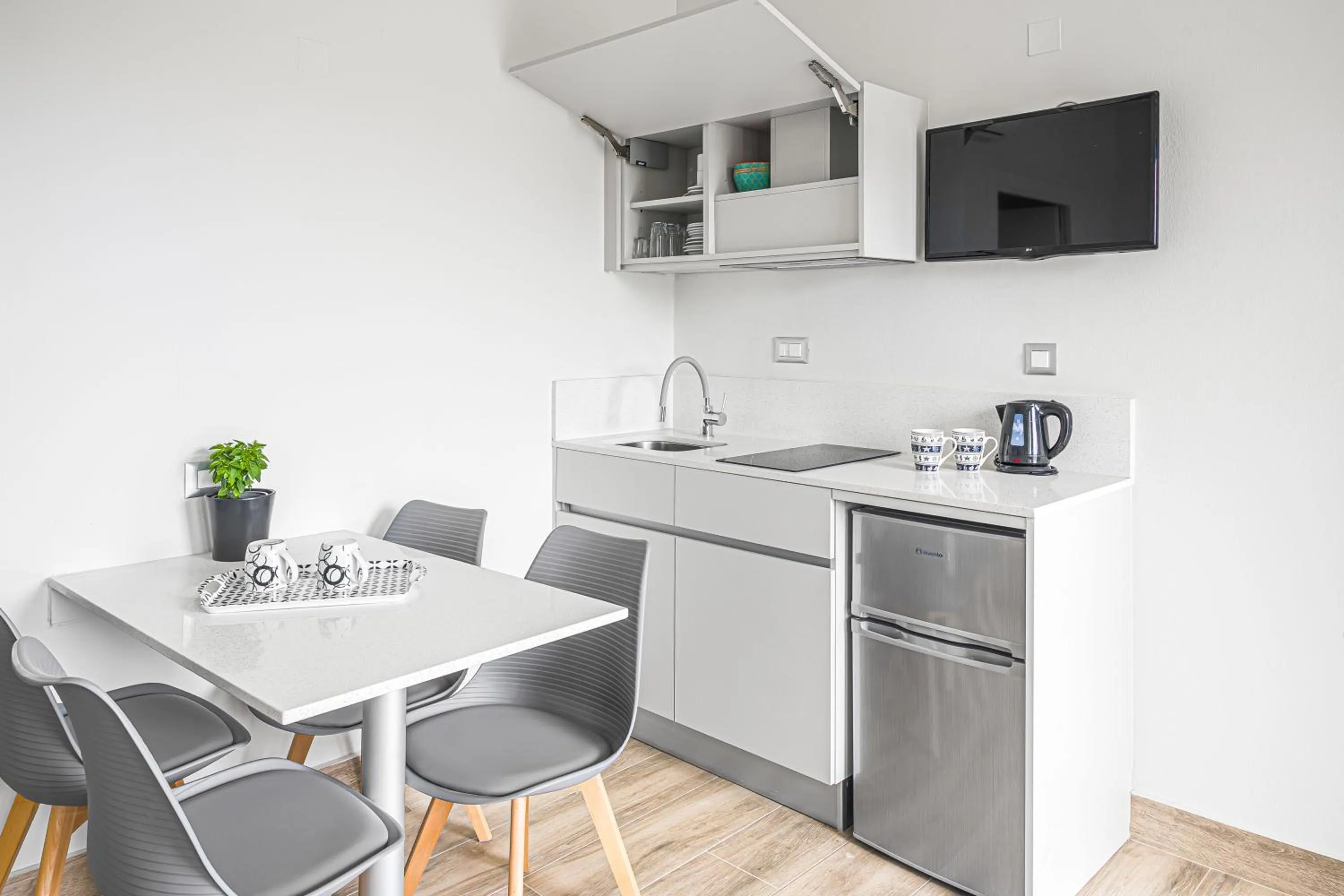 Kitchen or kitchenette in Sergiani Garden Hotel Apartments