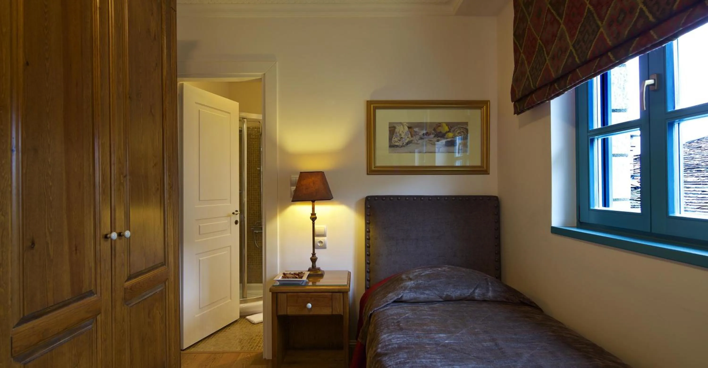 Bed in Zagori Suites Luxury Residences