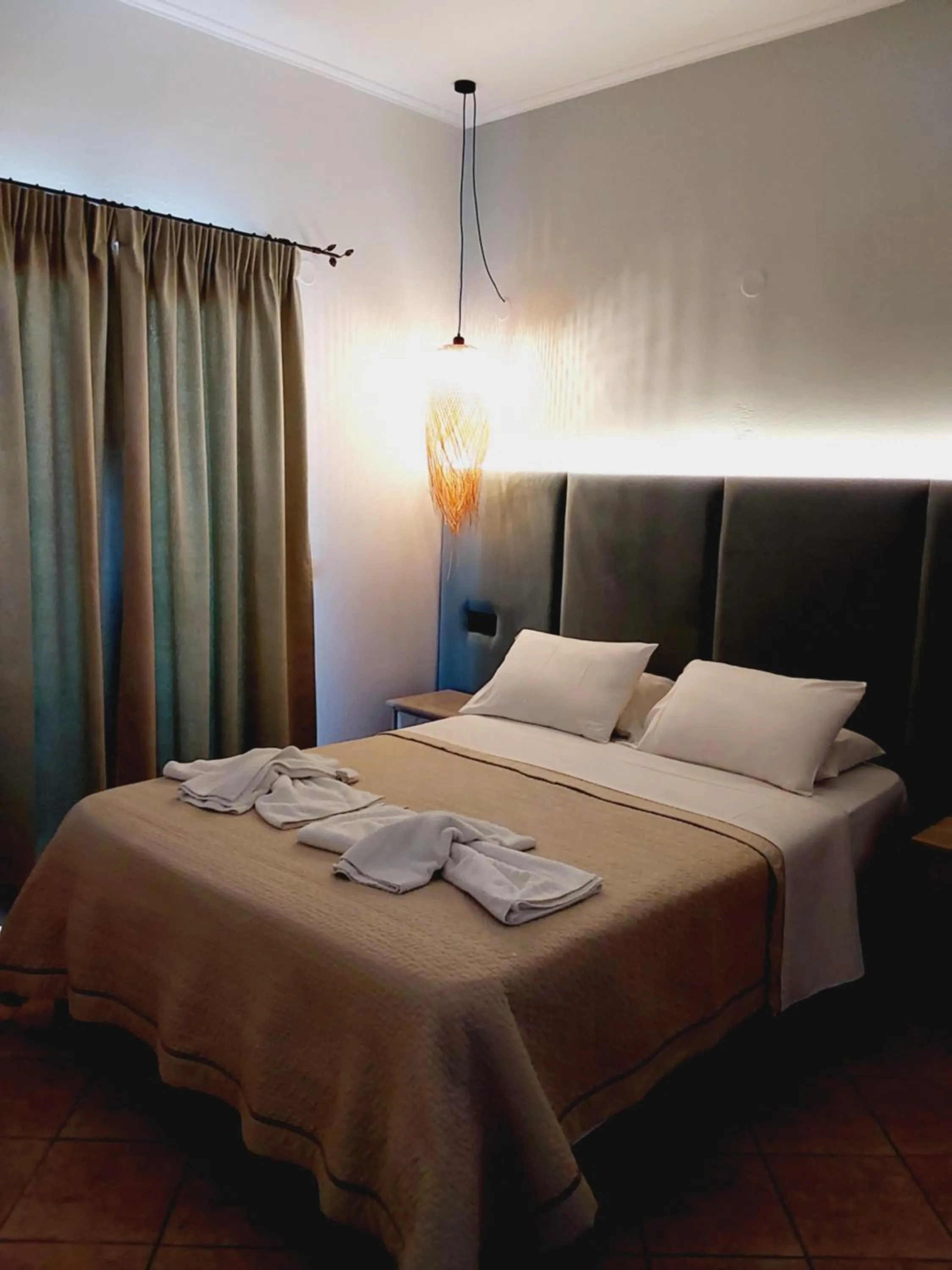 Bed in Ninos On The Beach Hotel