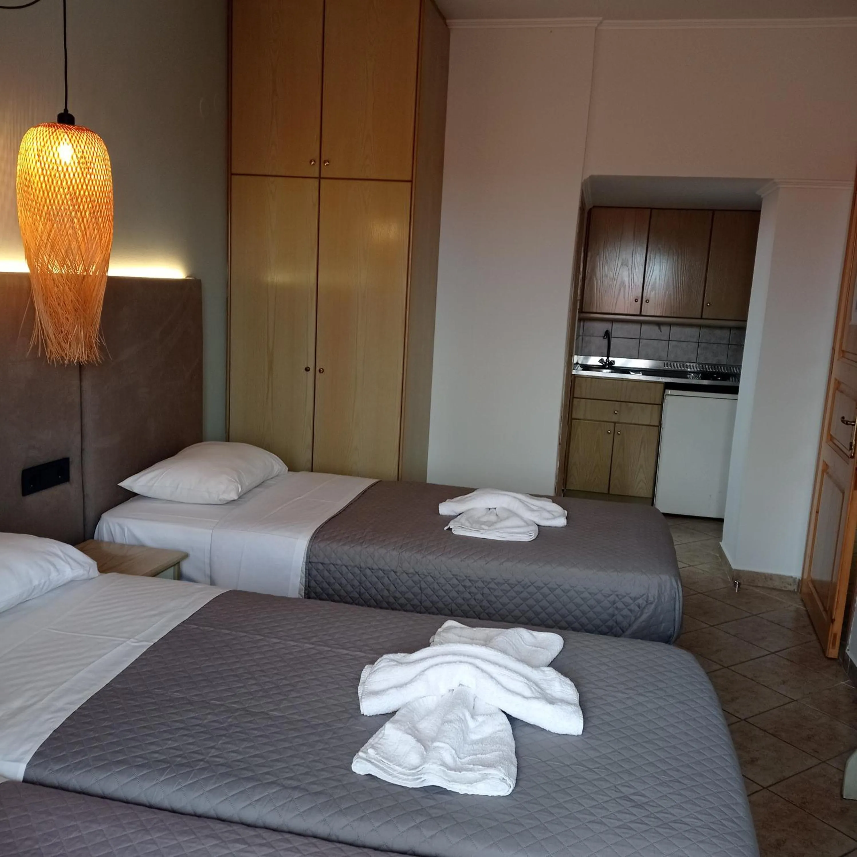 Bed in Ninos On The Beach Hotel