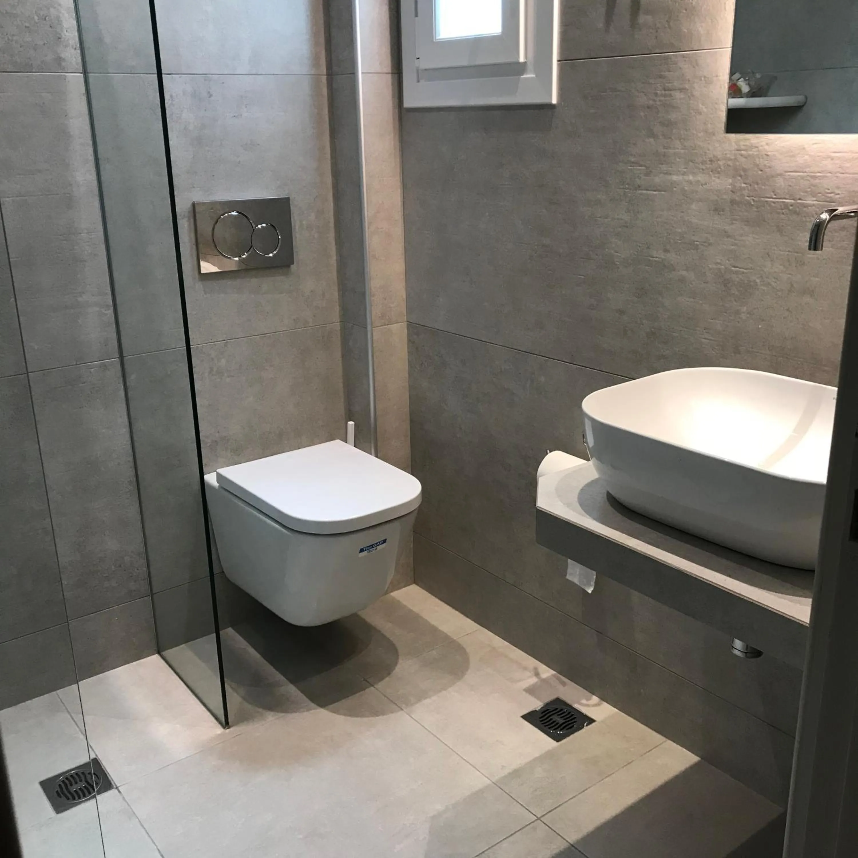 Bathroom in Vassiliki Rooms