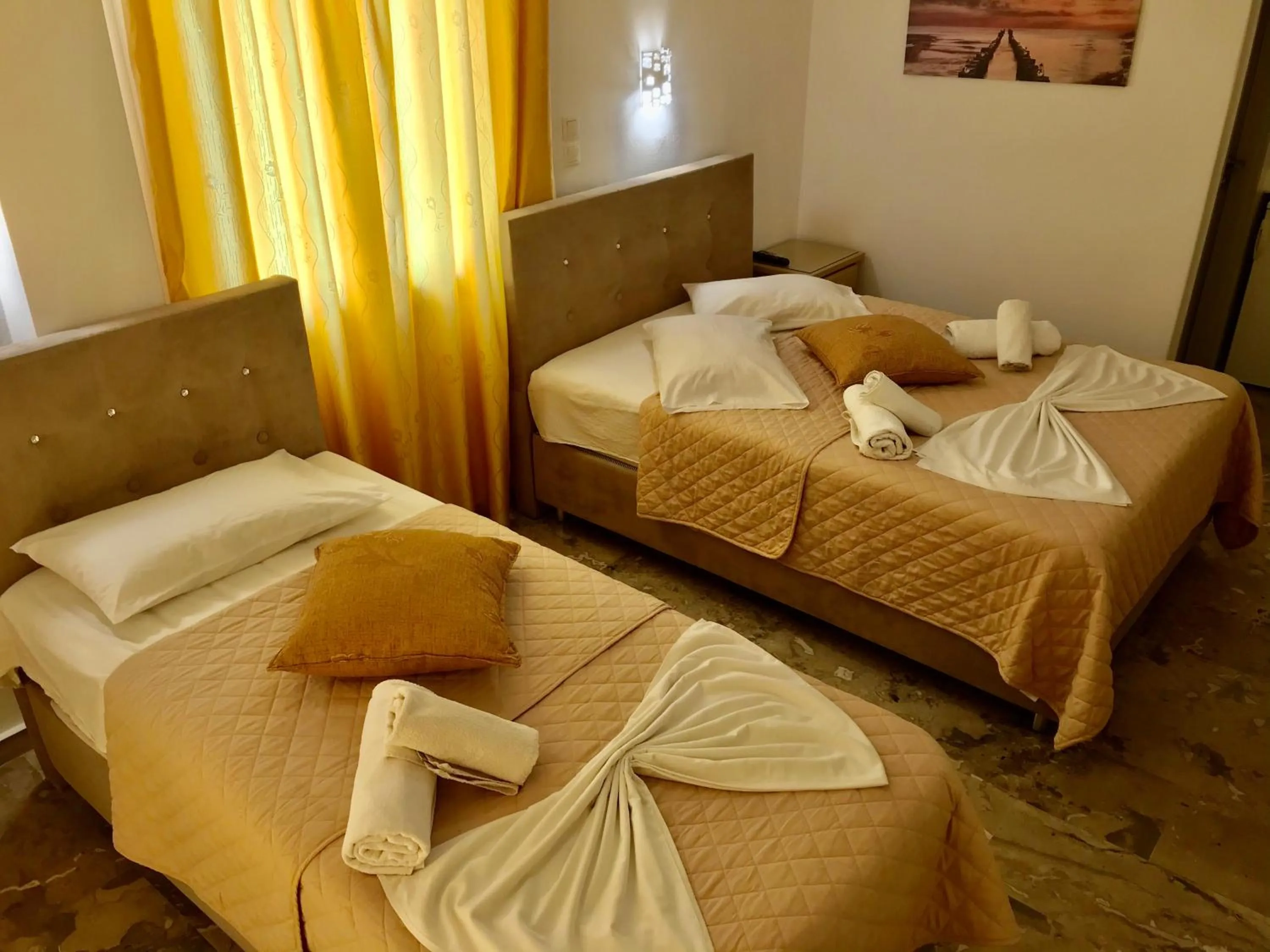 Bed in Vassiliki Rooms