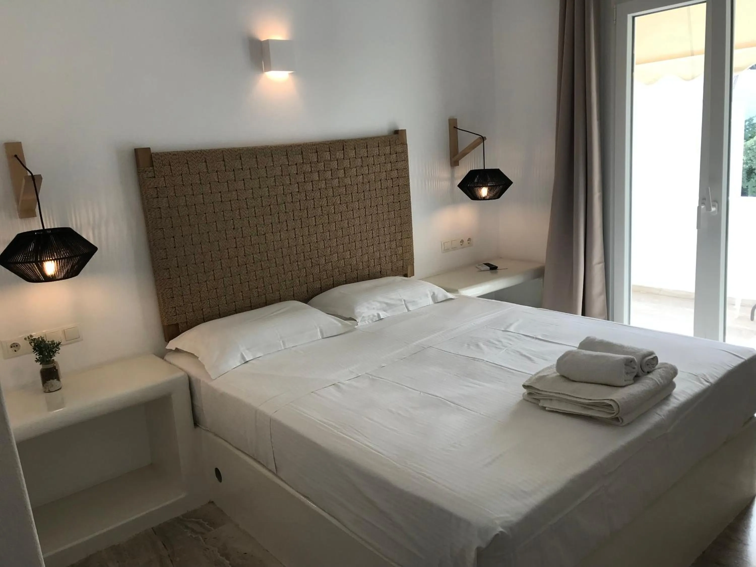 Bed in Vassiliki Rooms