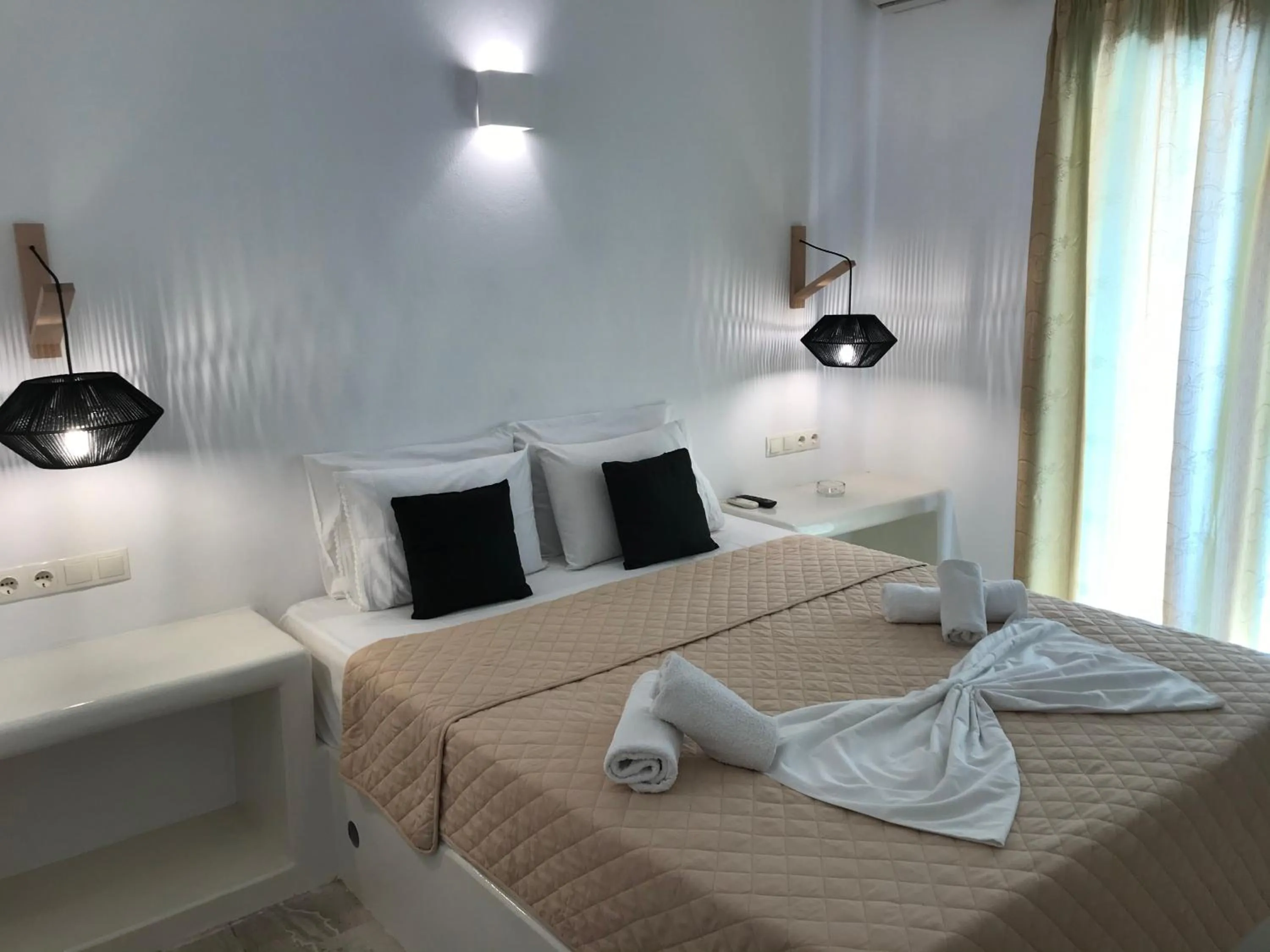 Bed in Vassiliki Rooms