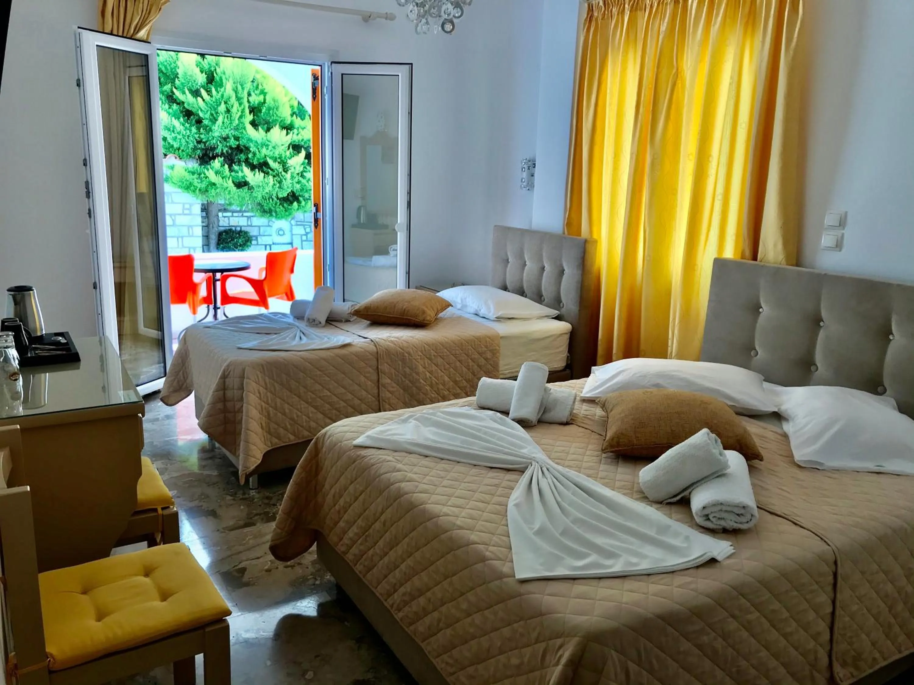 Bed in Vassiliki Rooms