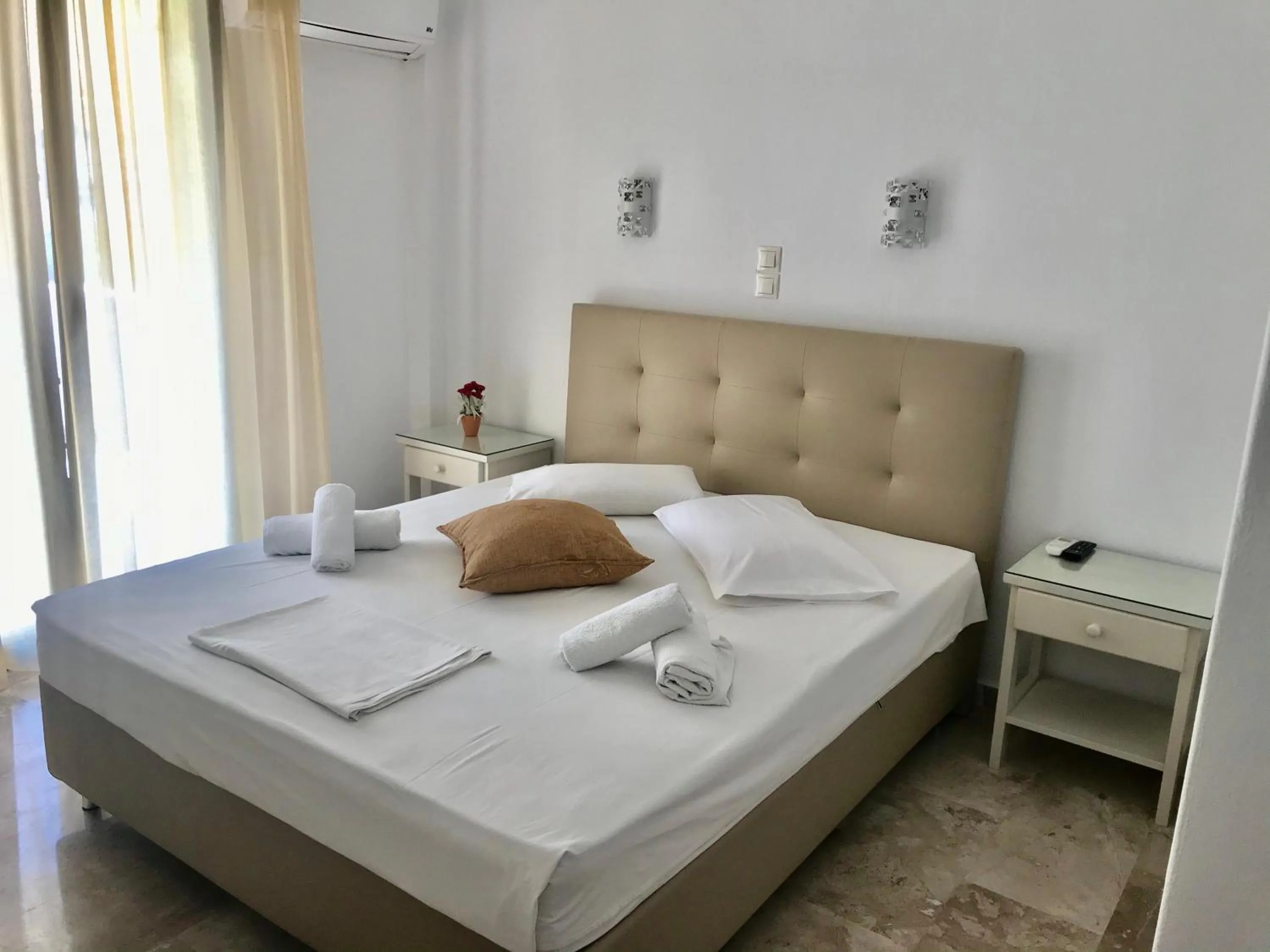 Bed in Vassiliki Rooms