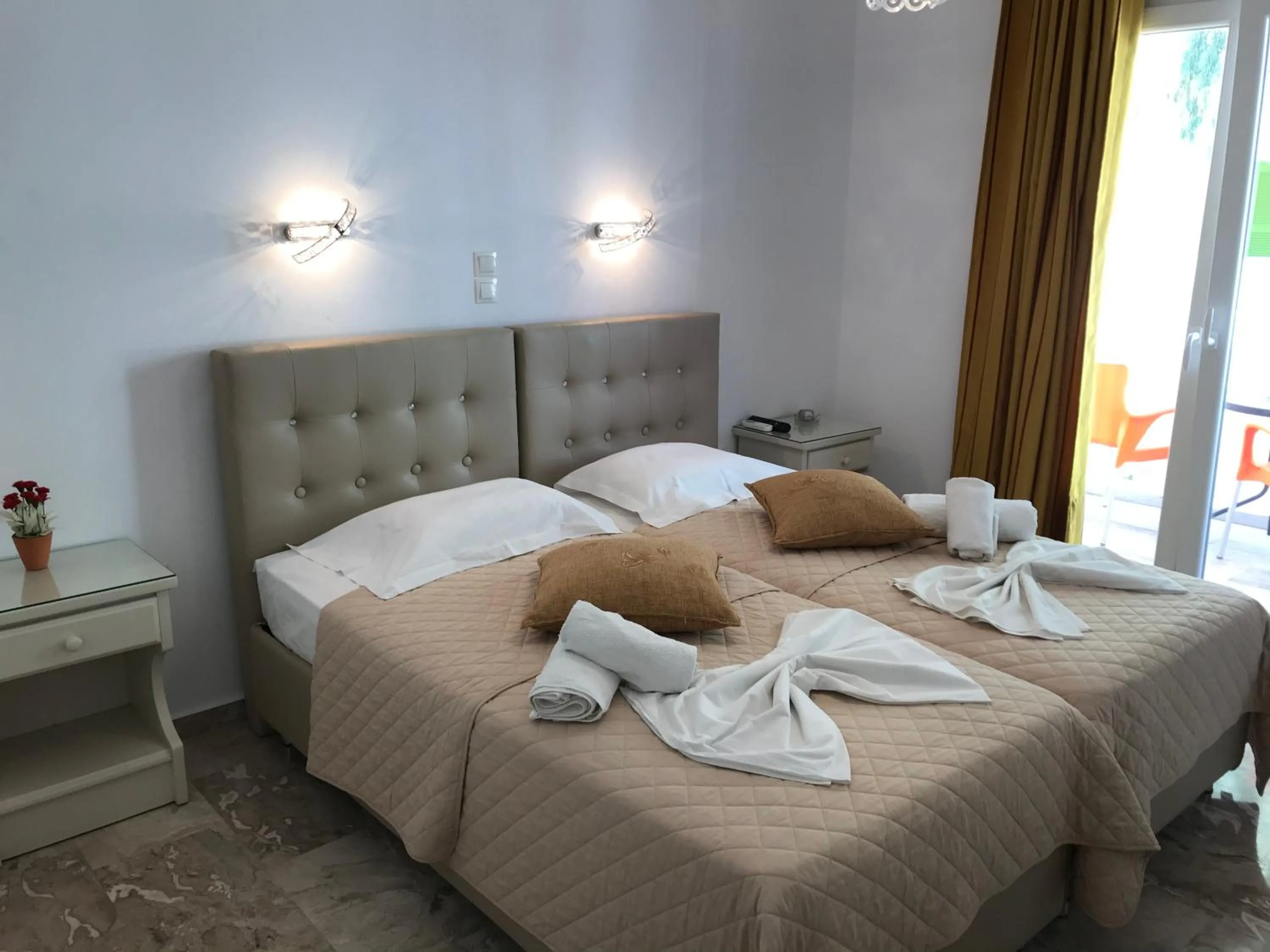 Bed in Vassiliki Rooms