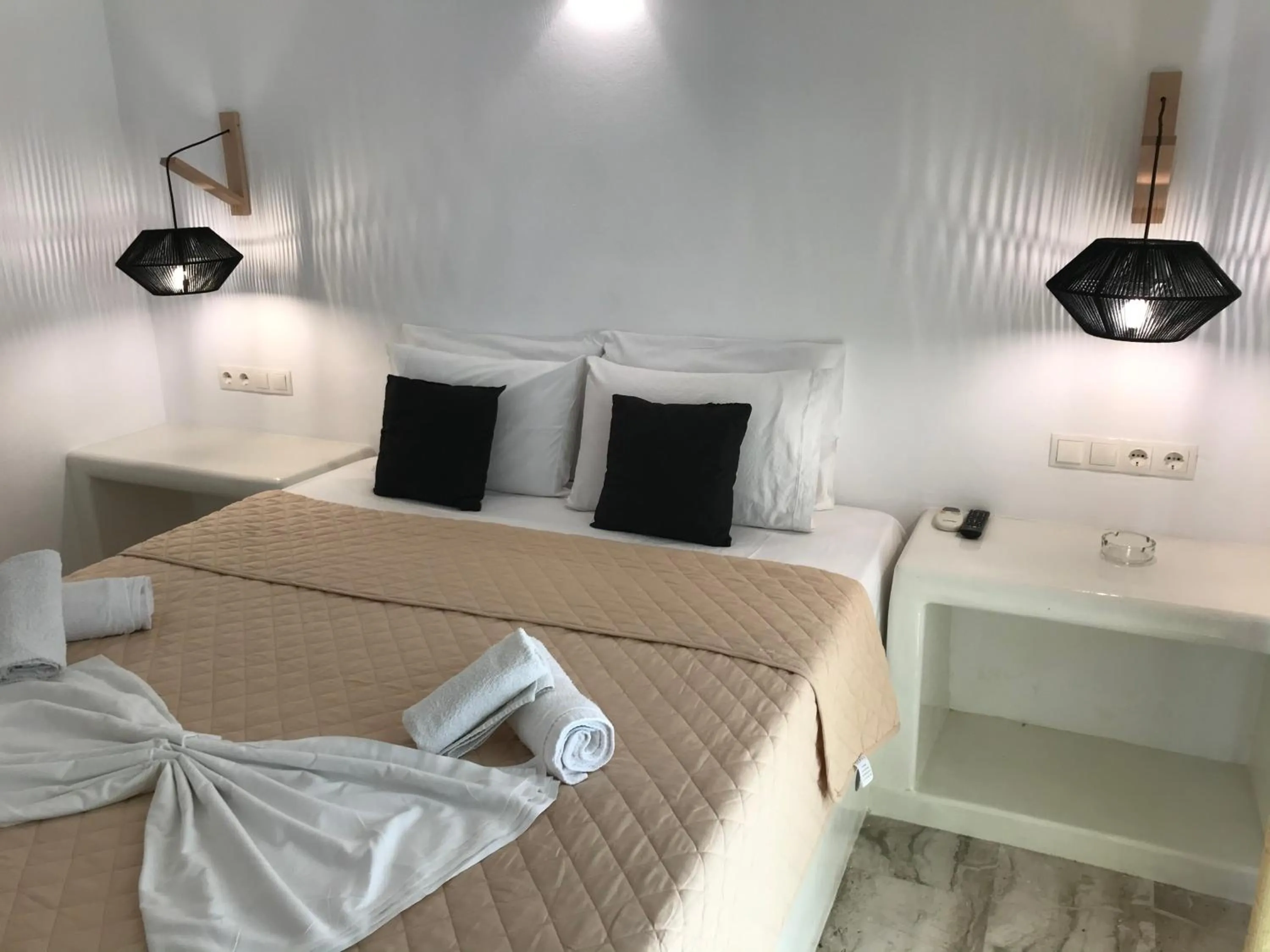 Bed in Vassiliki Rooms