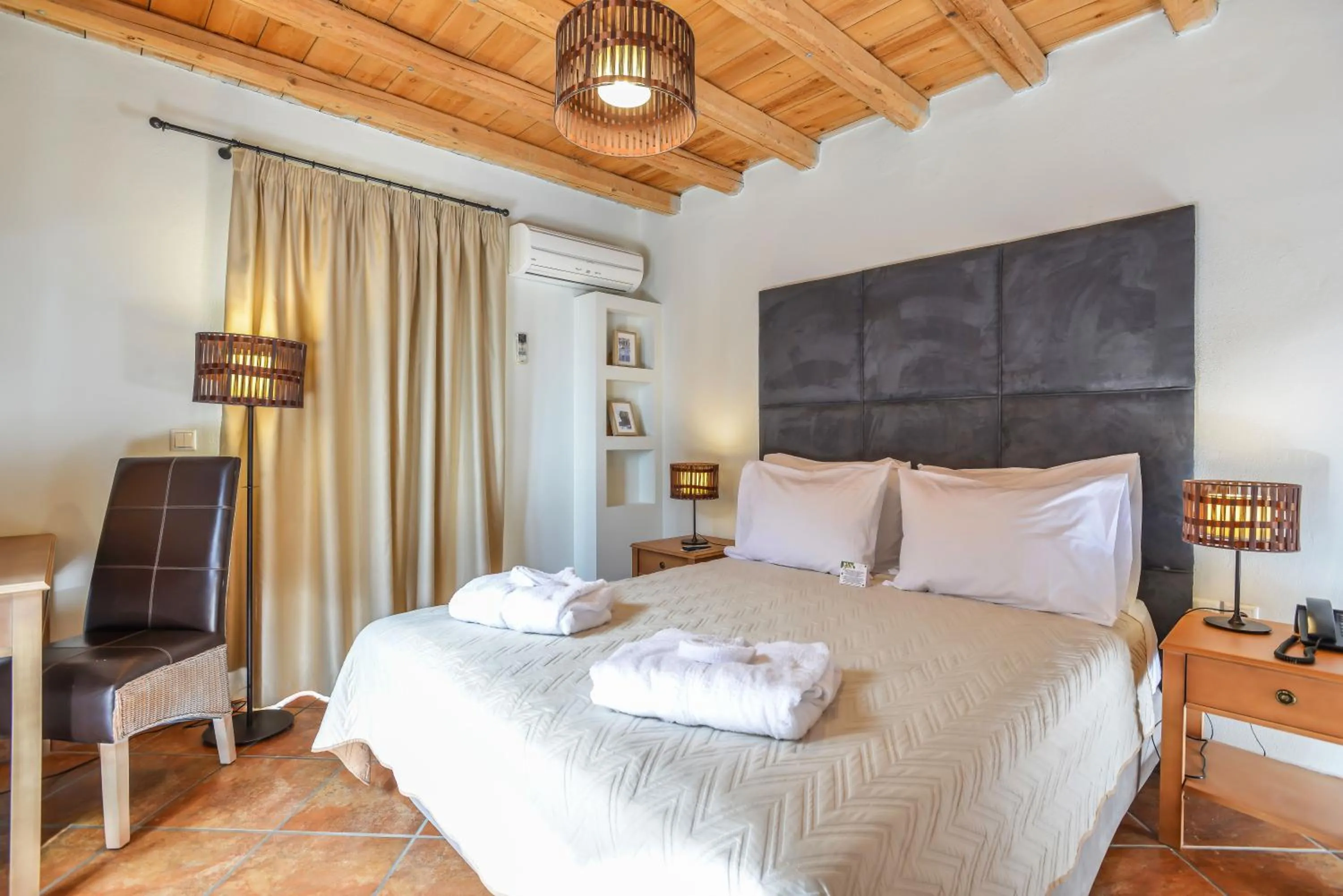 Bed in Varos Village Boutique Hotel