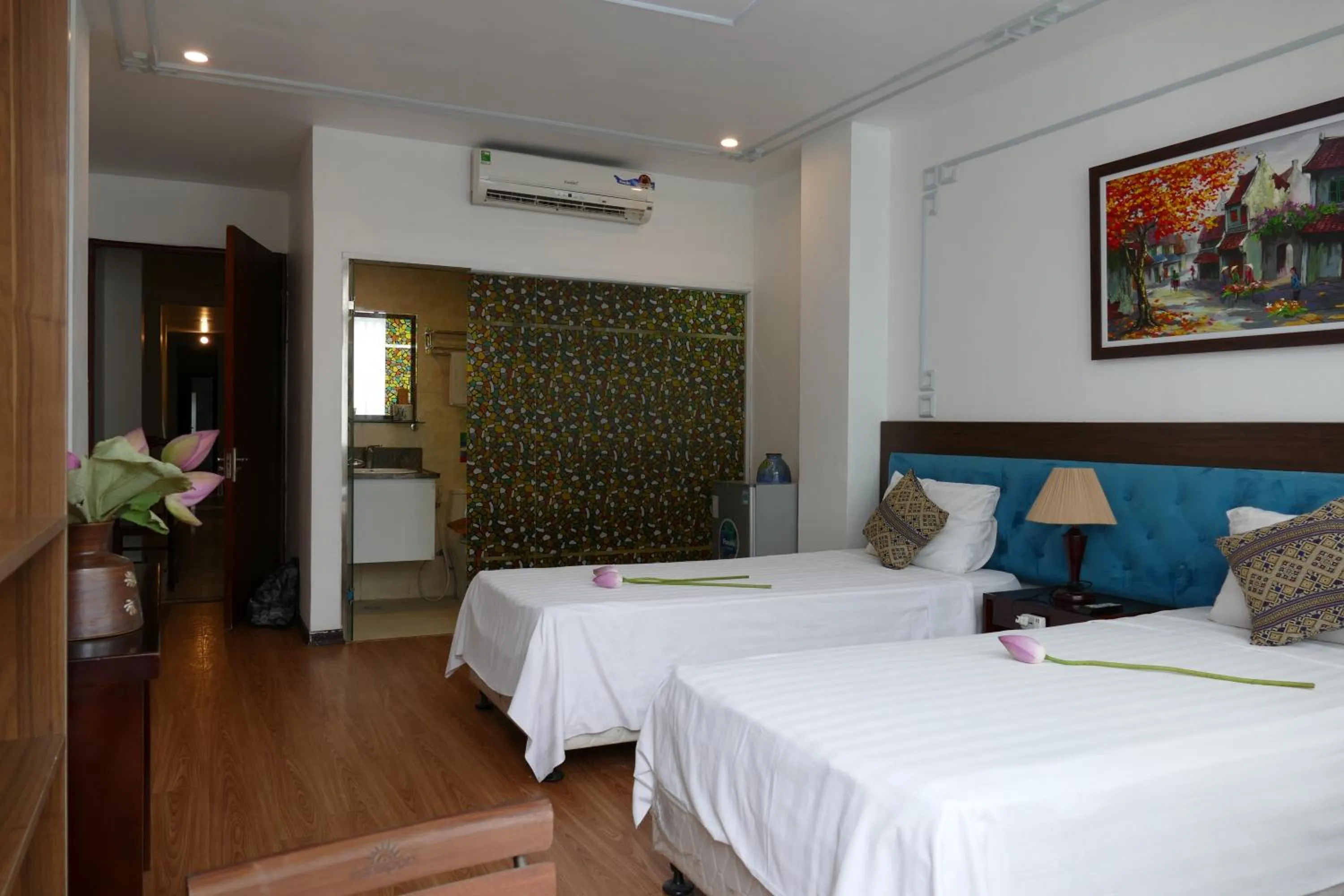 Bed in Maison d'Hanoi Hotel