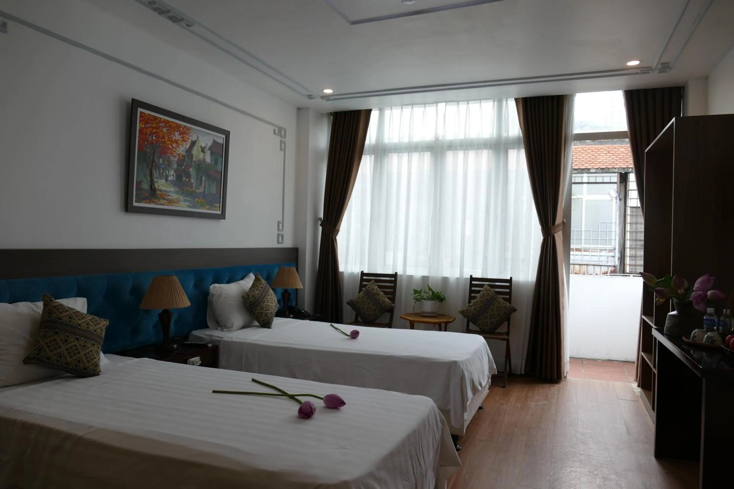 Bed in Maison d'Hanoi Hotel