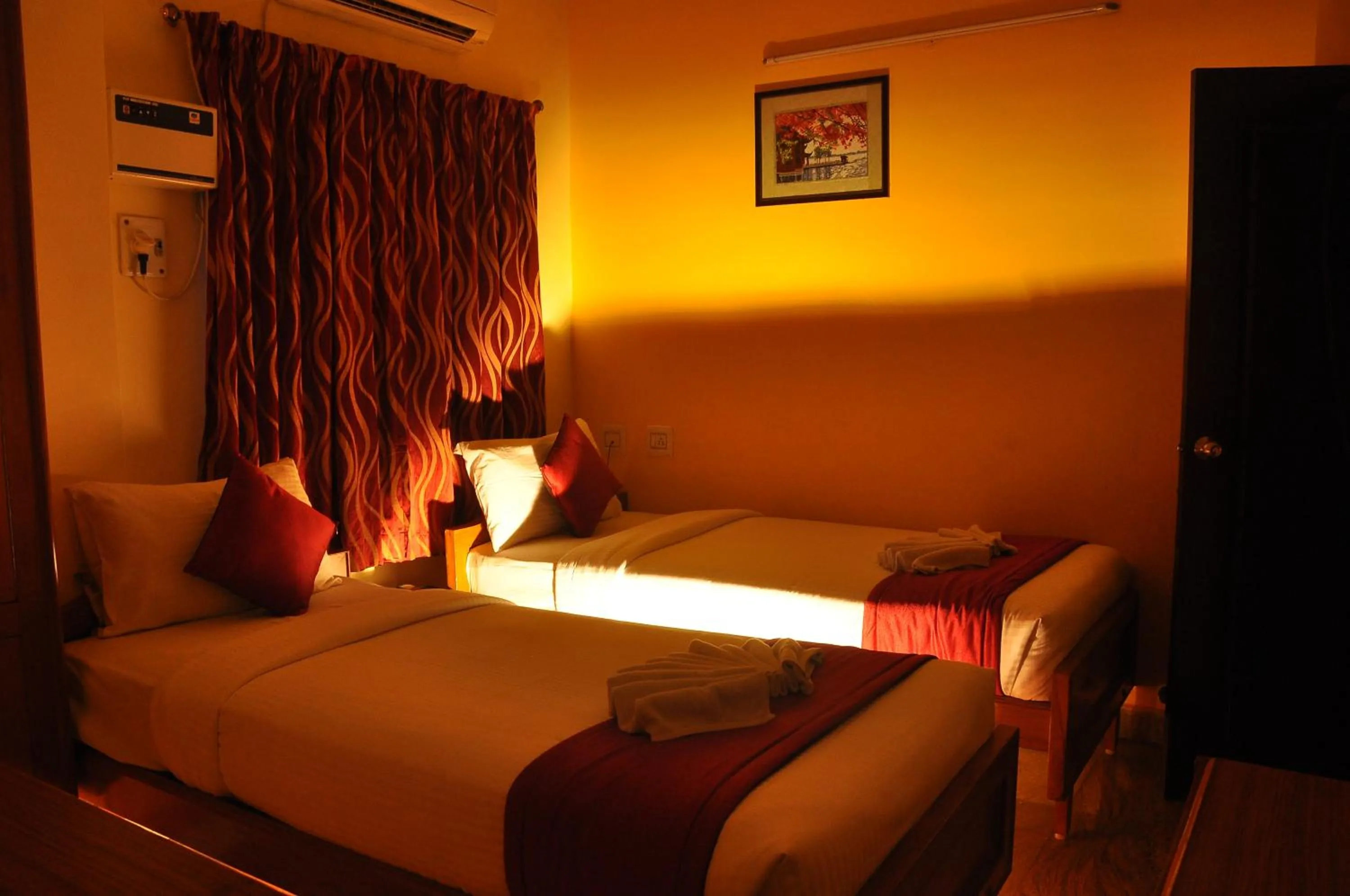 Bed in Green Grande Inn