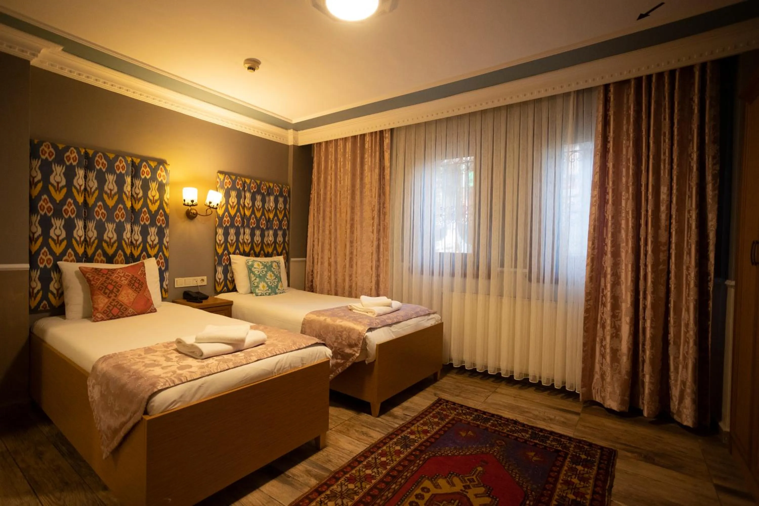 Bed in Tashkonak Studio Suites