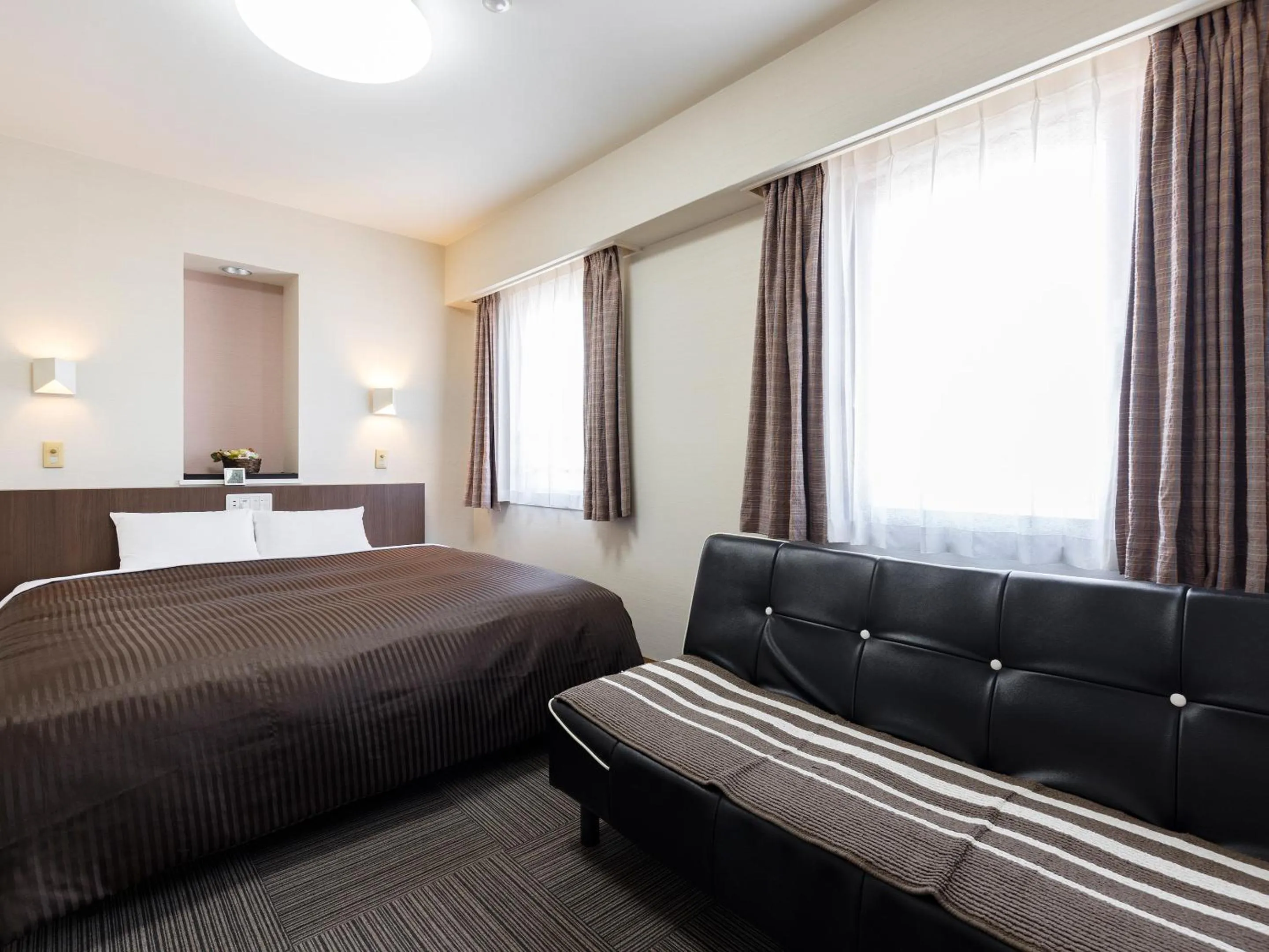 Photo of the whole room, Bed in Hotel Wing International Izumi
