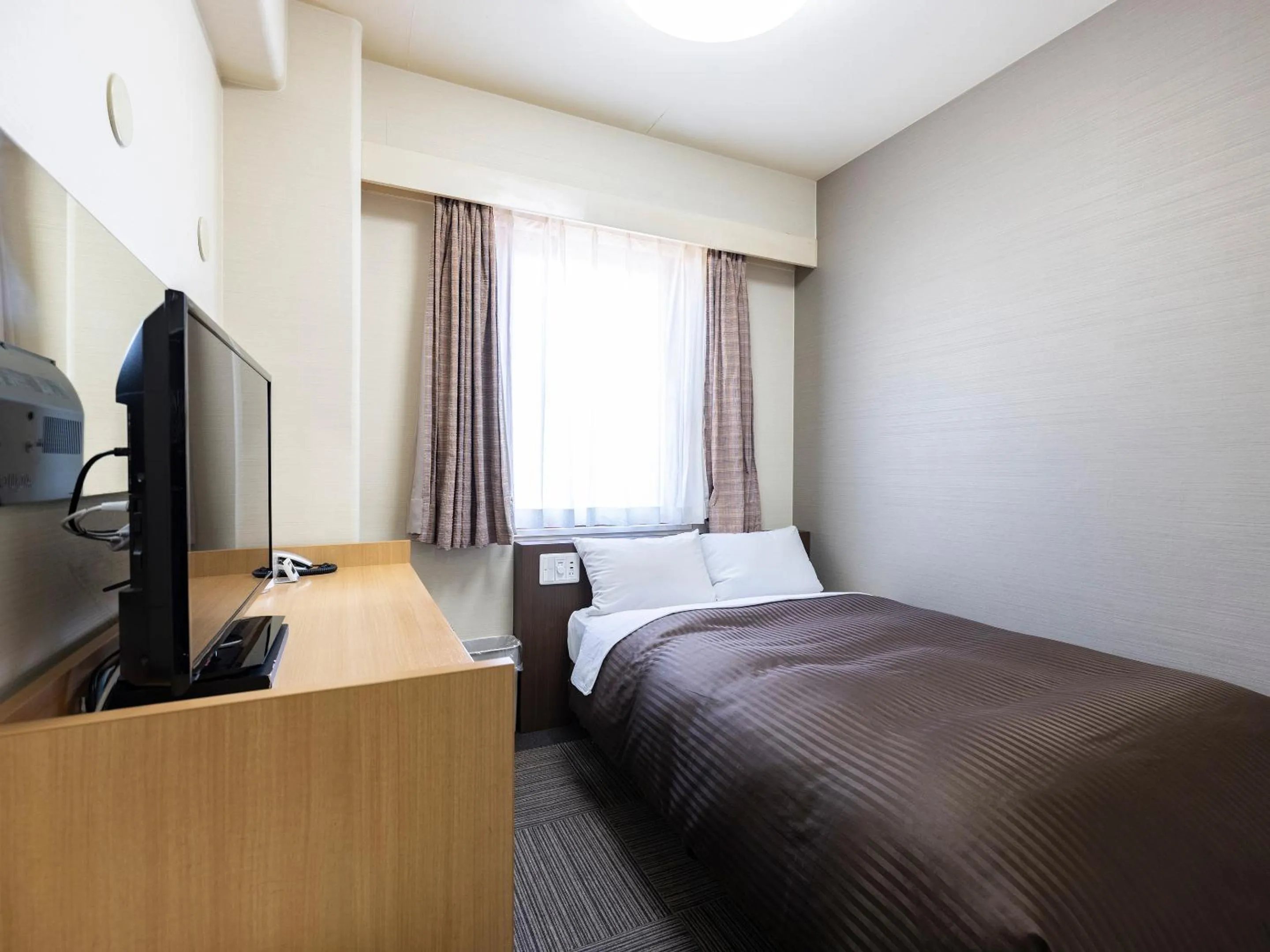 Photo of the whole room, Bed in Hotel Wing International Izumi