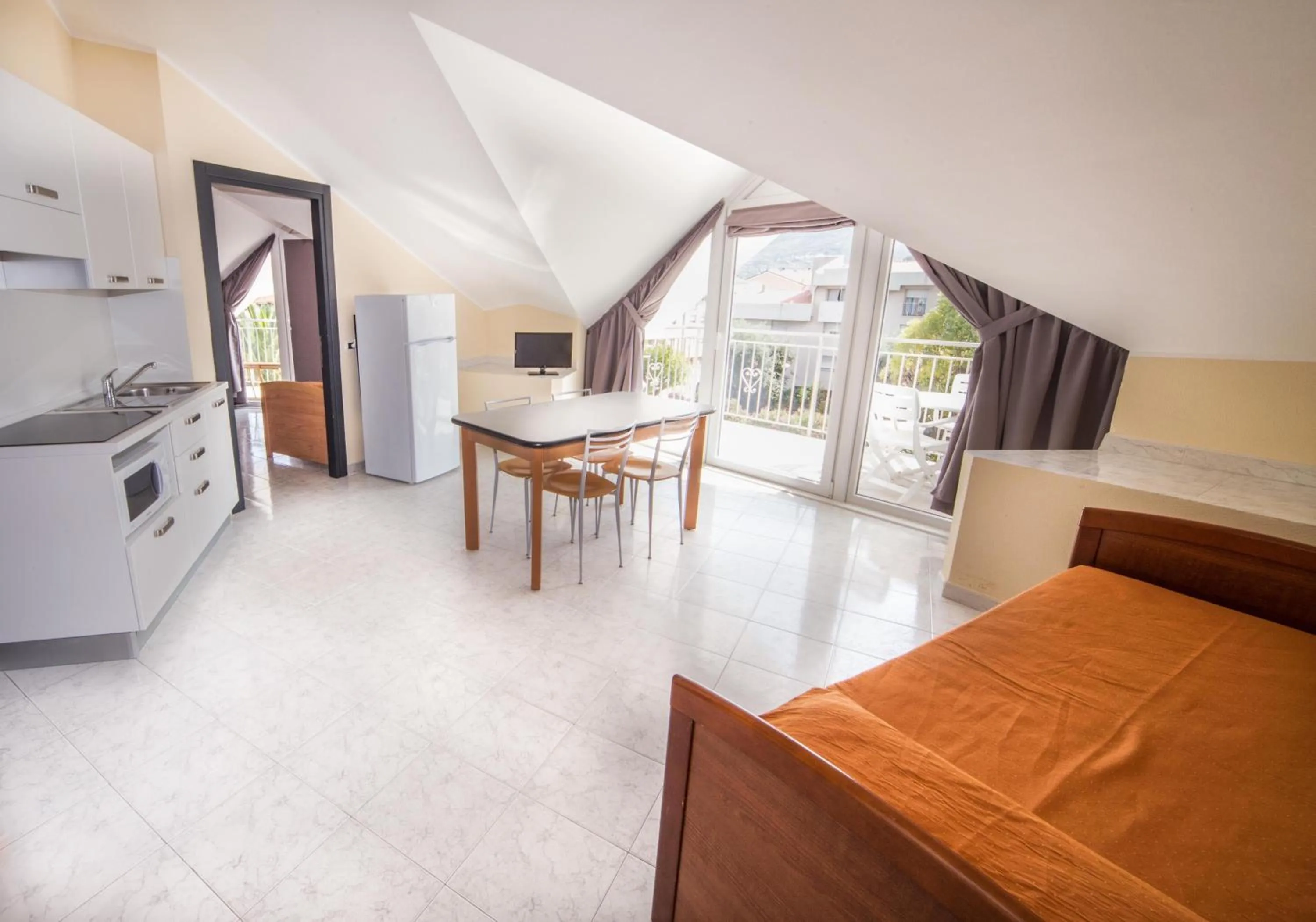 Kitchen or kitchenette, Bed in Diano Sporting Apartments