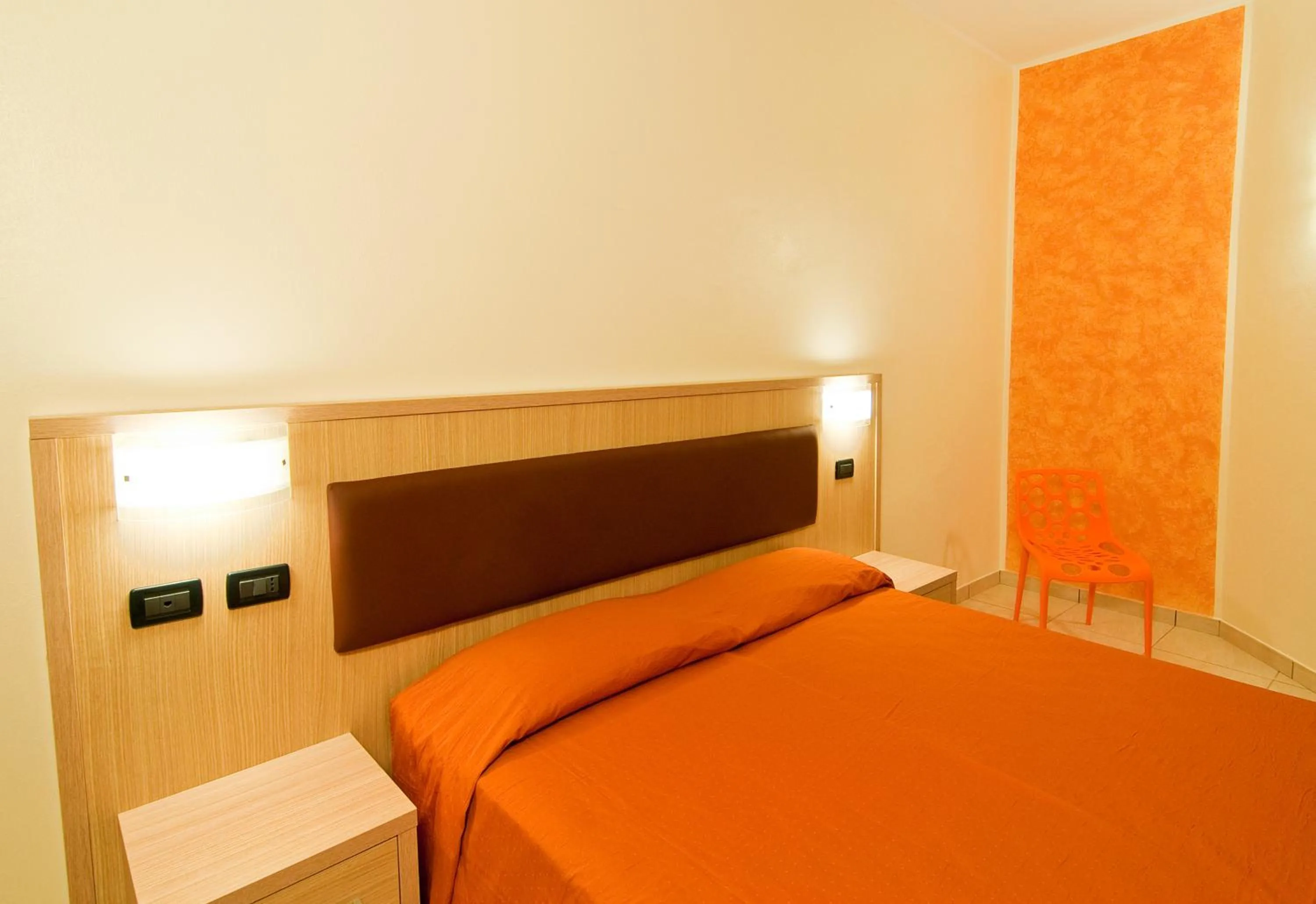 Bed in Diano Sporting Apartments