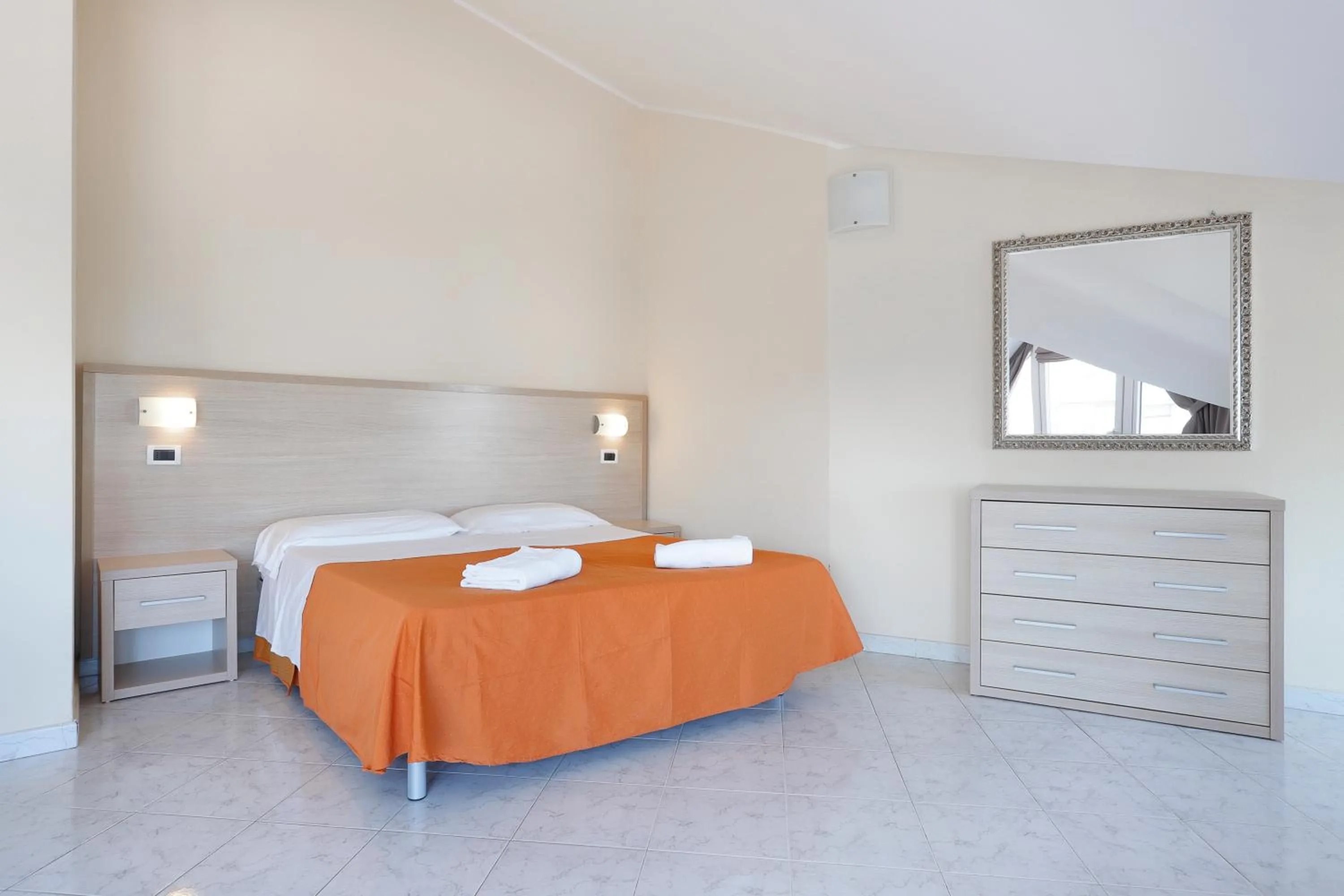 Bed in Diano Sporting Apartments