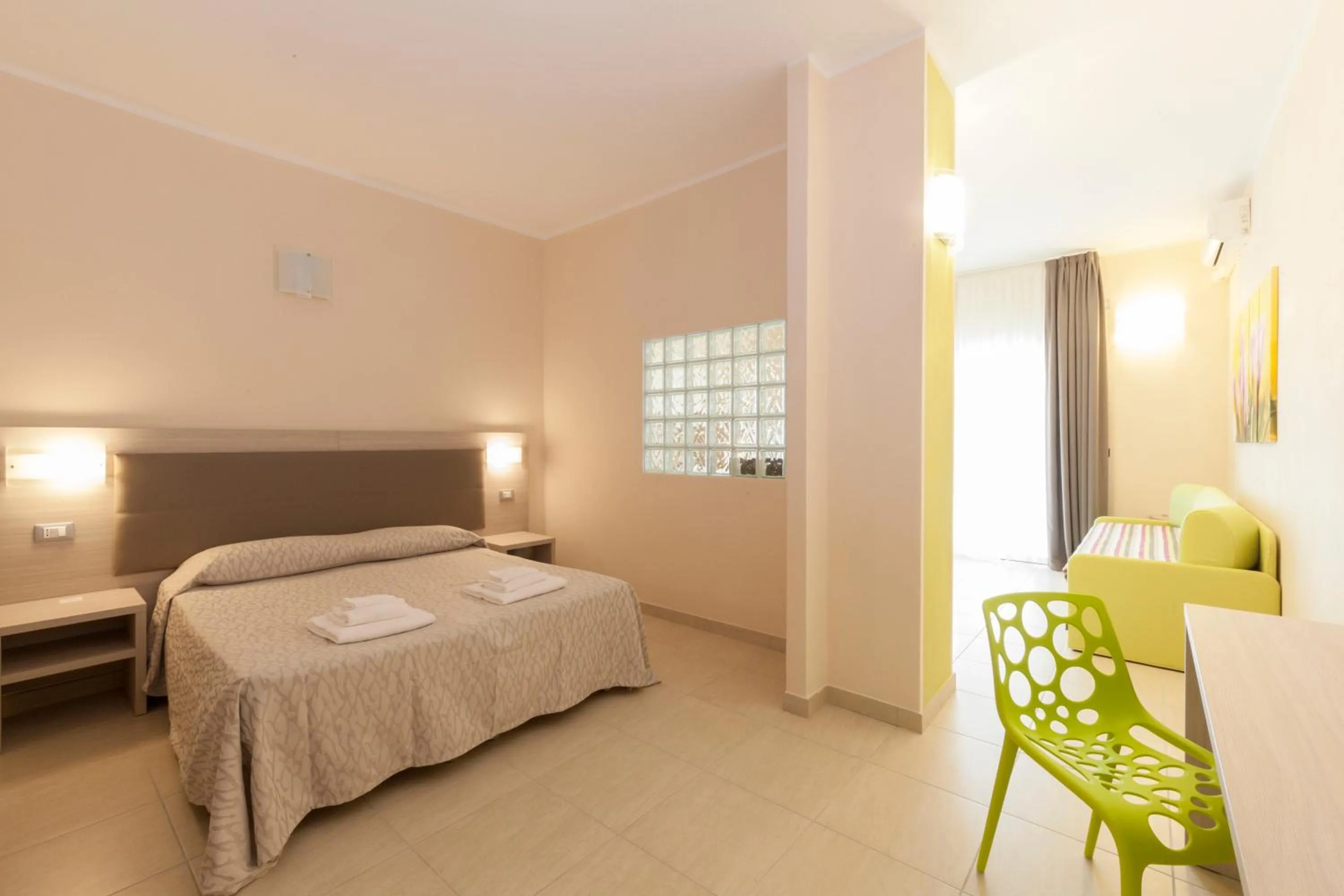 Bed in Diano Sporting Apartments