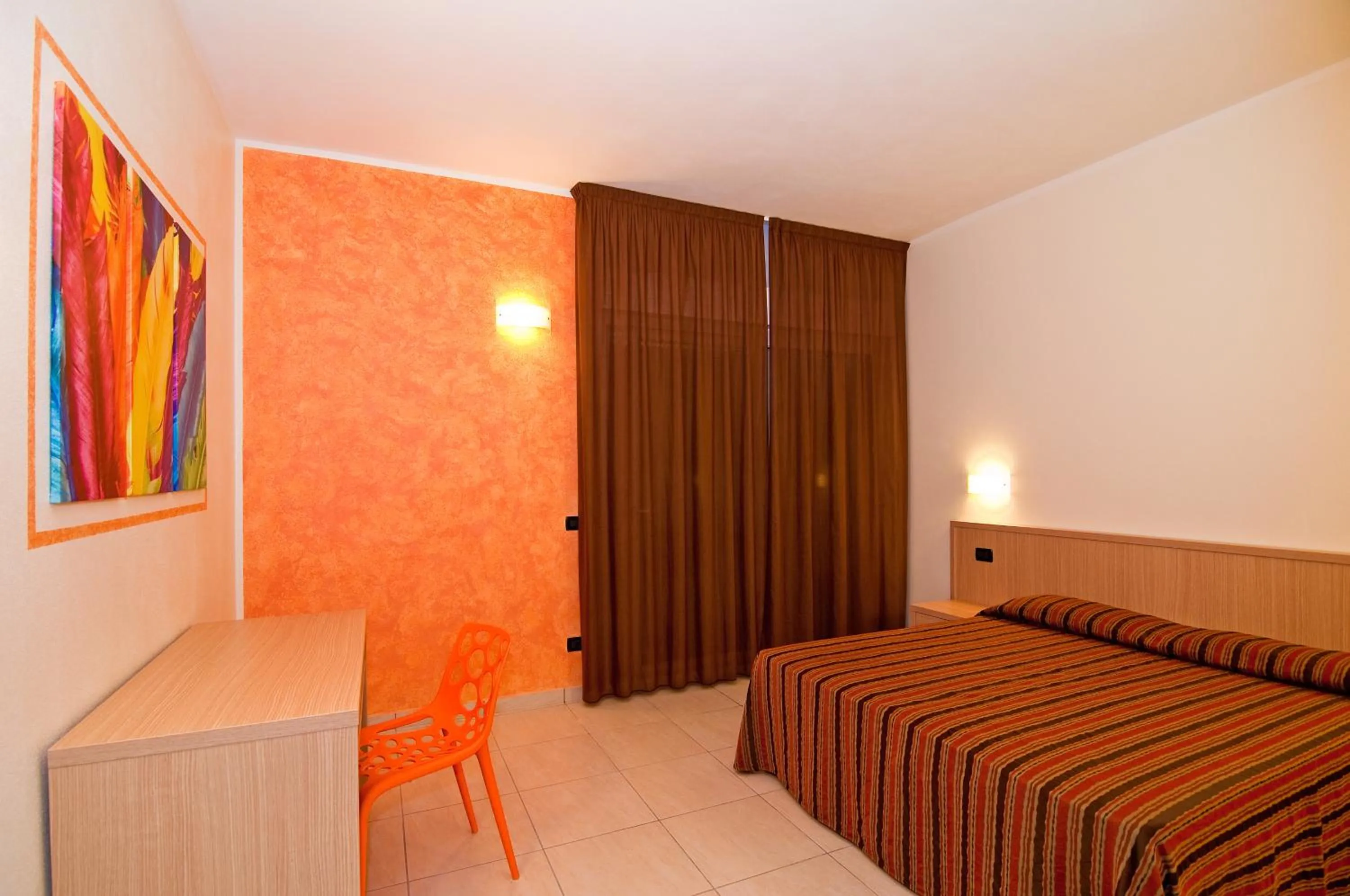 Seating area, Bed in Diano Sporting Apartments
