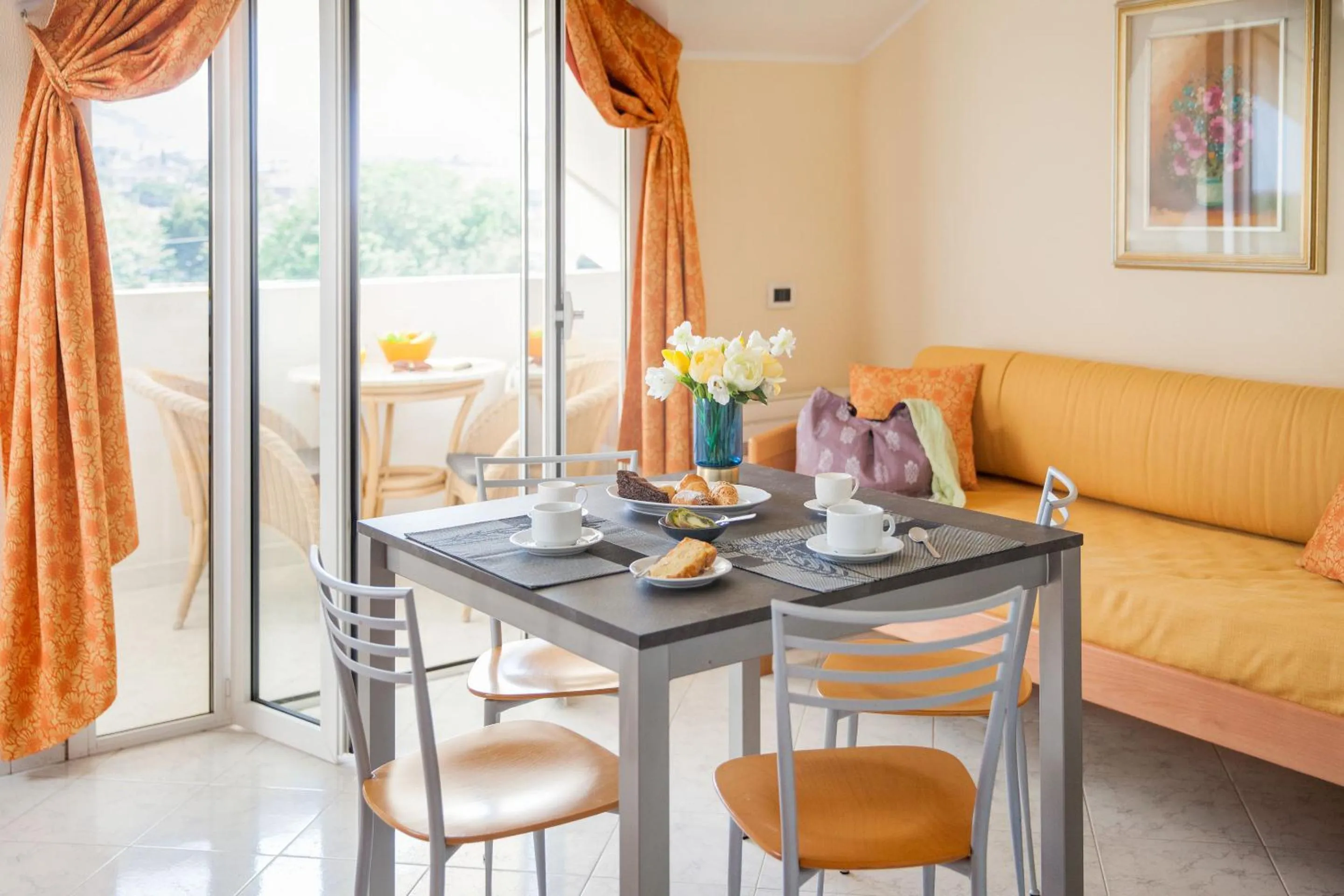 Seating area in Diano Sporting Apartments