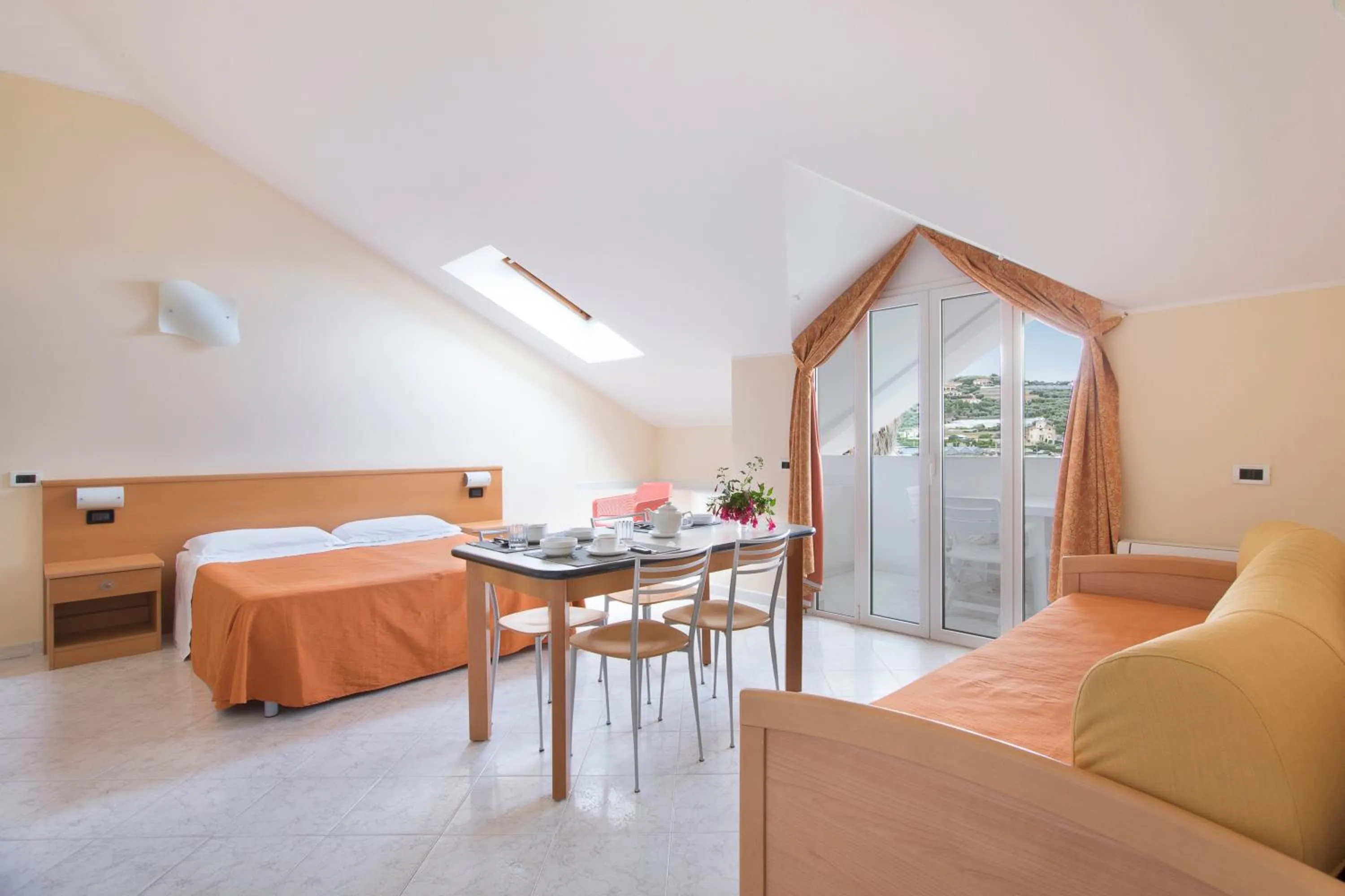 Bed in Diano Sporting Apartments