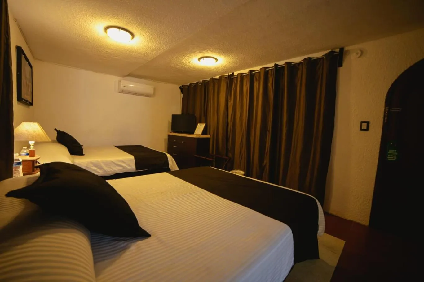 Bedroom in Hill House Mazatlan - Bed & Breakfast