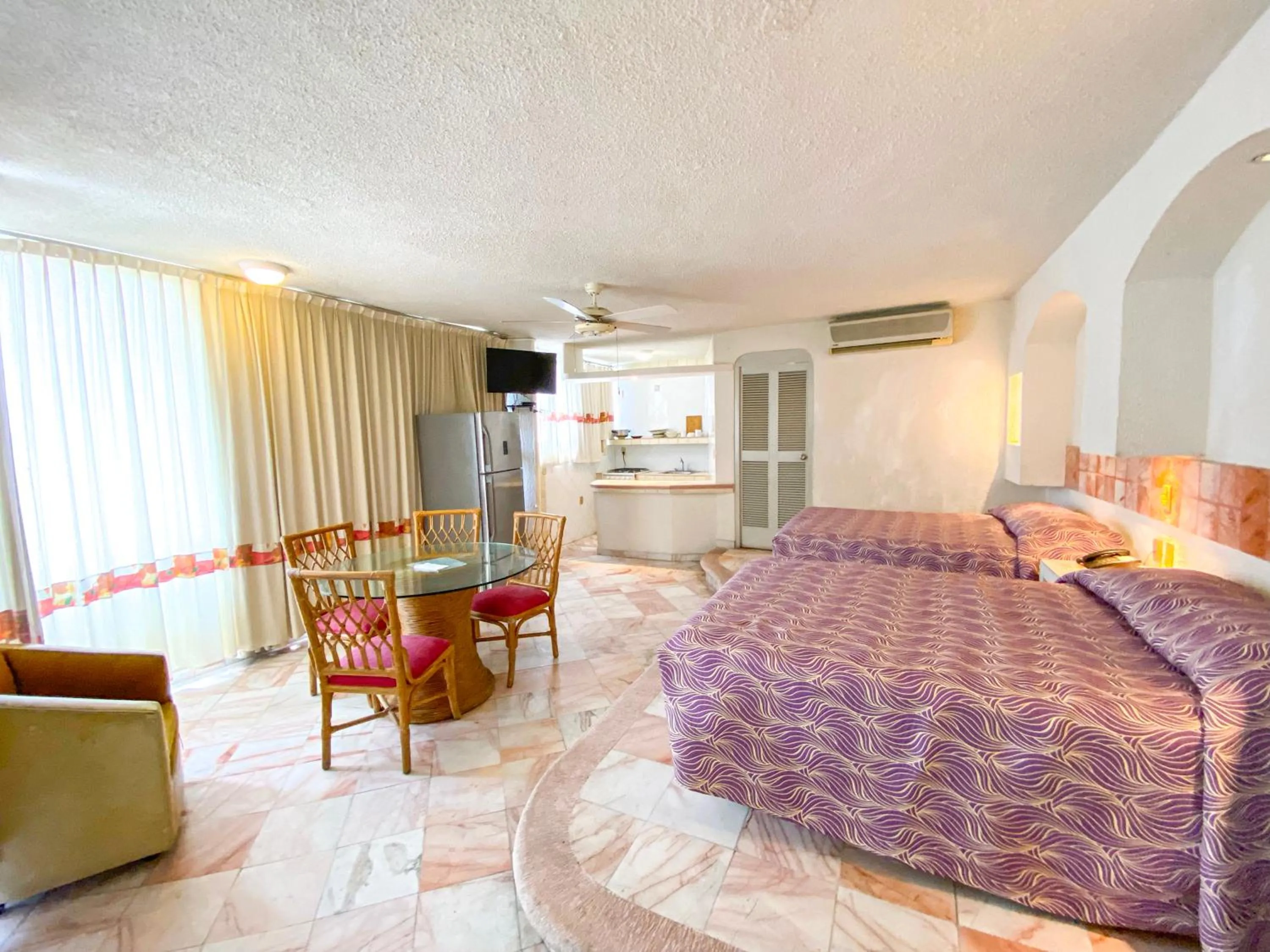 Bed in Hotel Suites Jazmín Acapulco