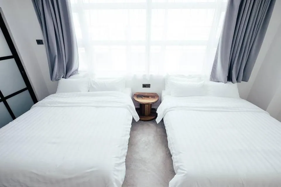 Bed in White Loft Hotel