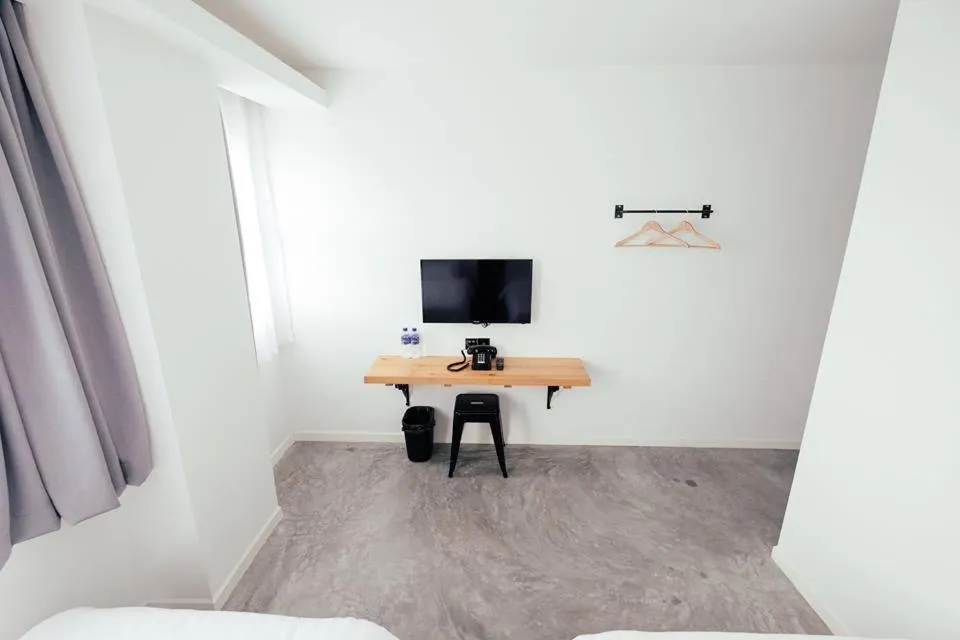 Bed in White Loft Hotel