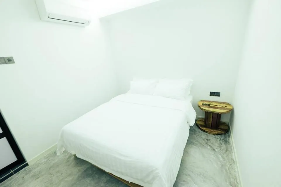 Bed in White Loft Hotel