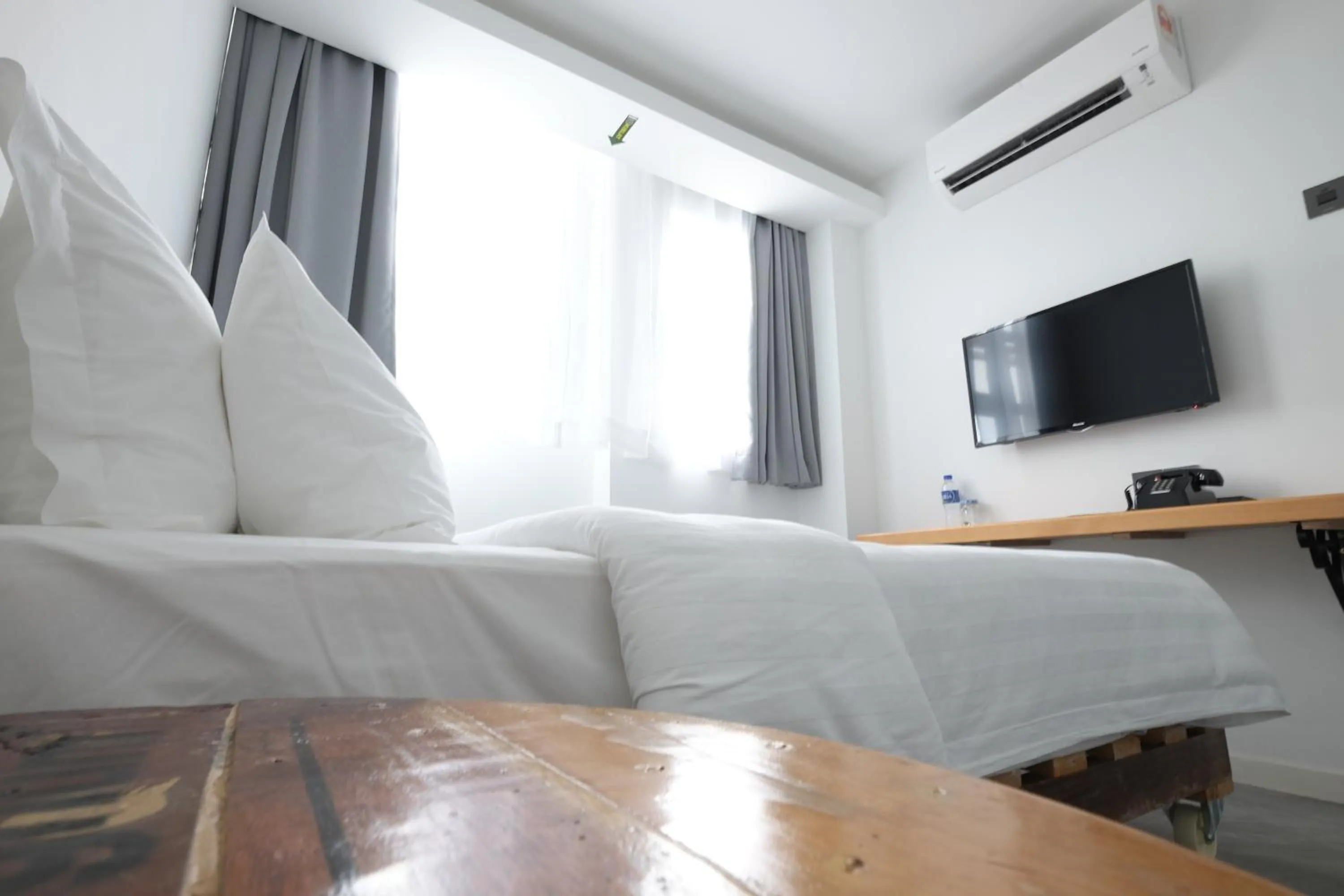 Bed in White Loft Hotel