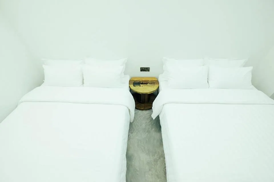 Bed in White Loft Hotel