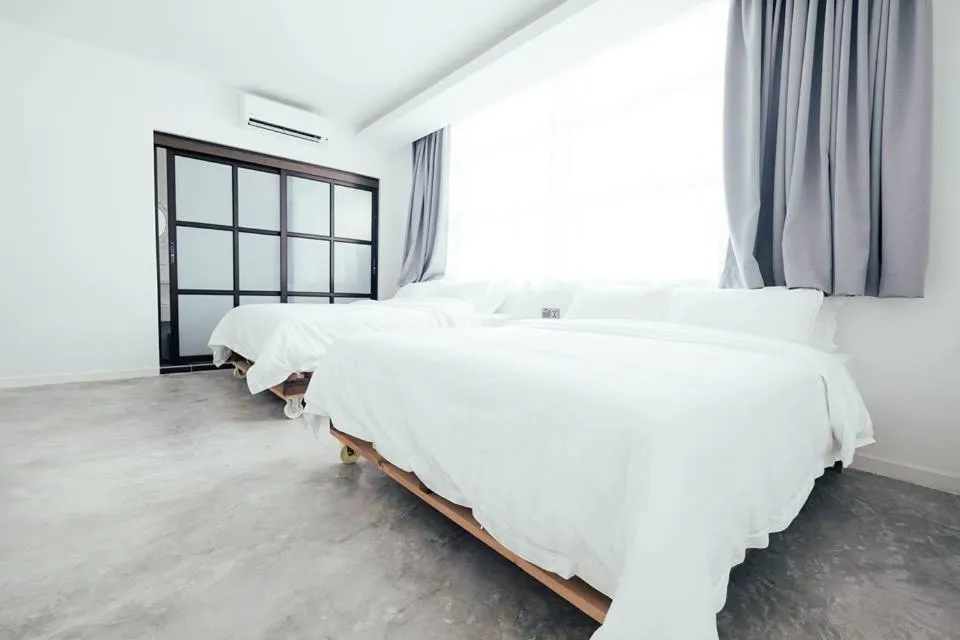 Bed in White Loft Hotel