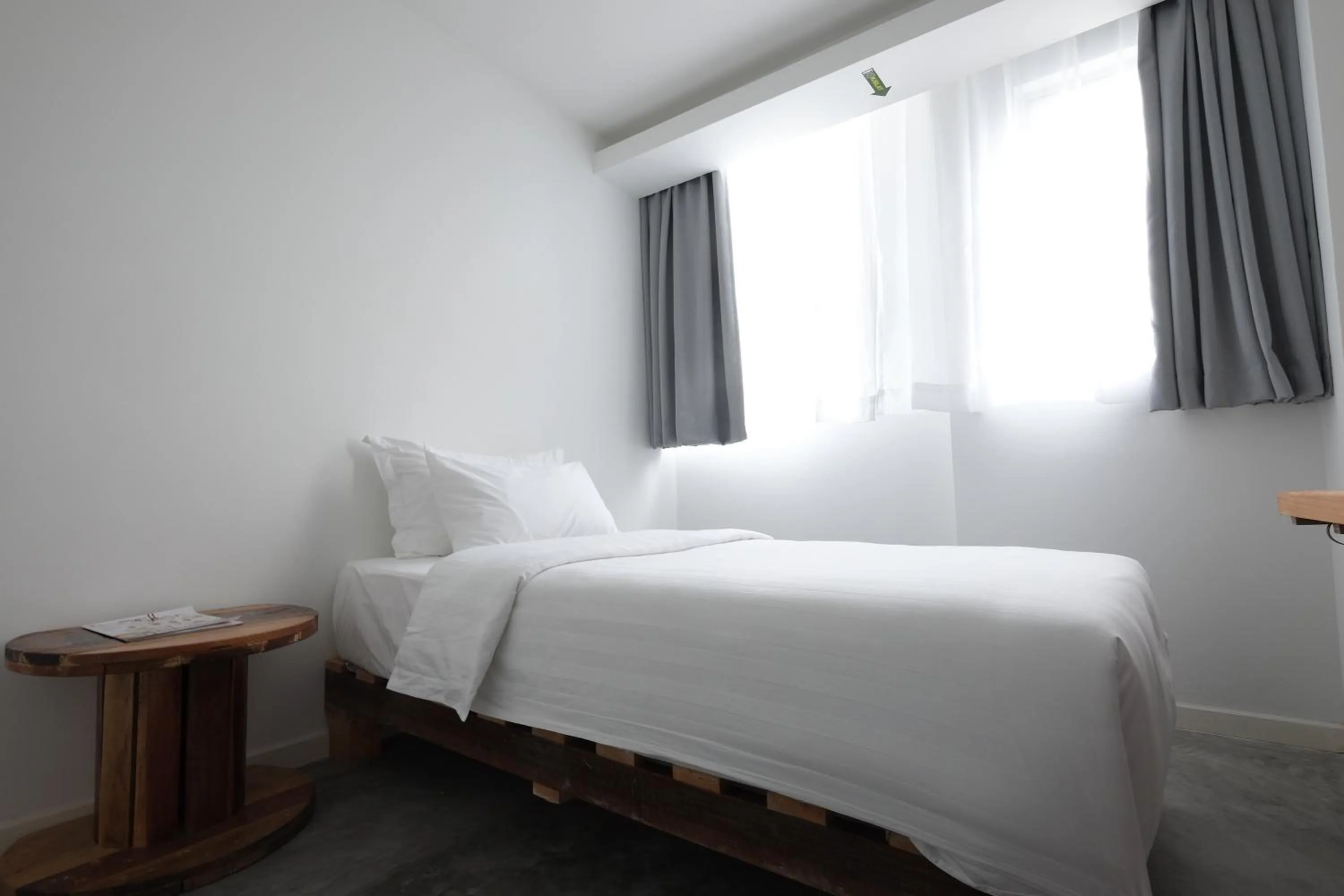 Bed in White Loft Hotel