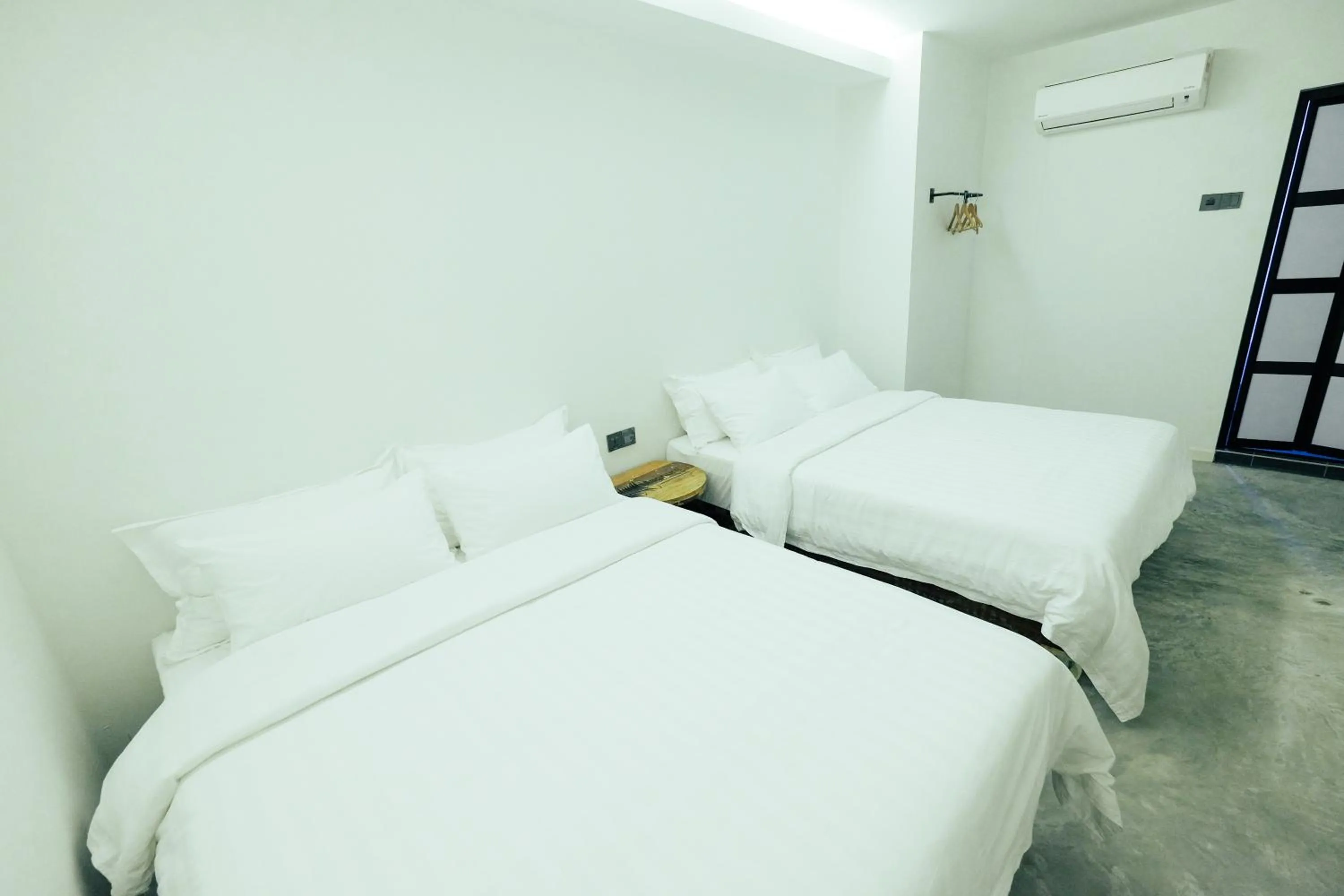 Bed in White Loft Hotel