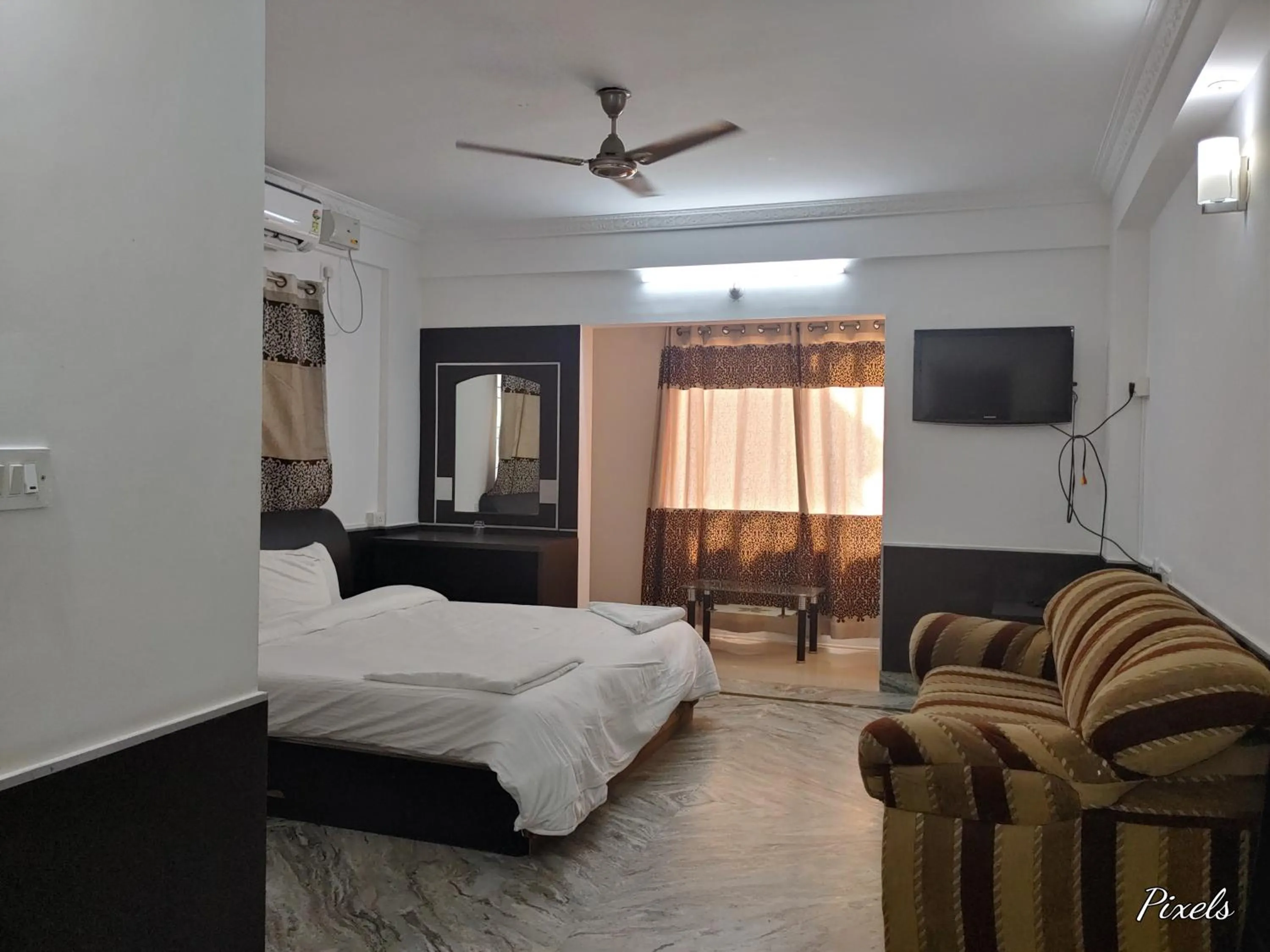 Living room, Bed in Sai Pavilion