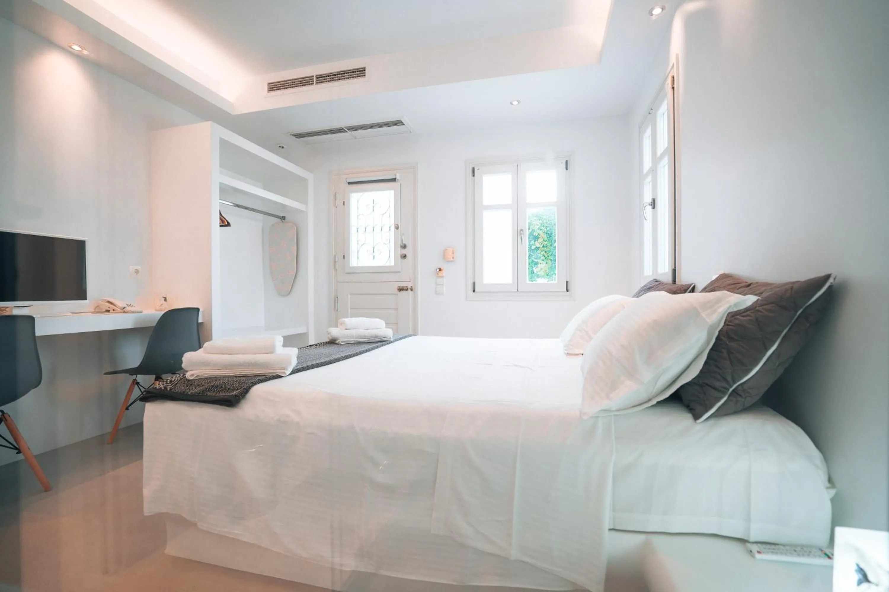 Bed in Alexandros Apartments