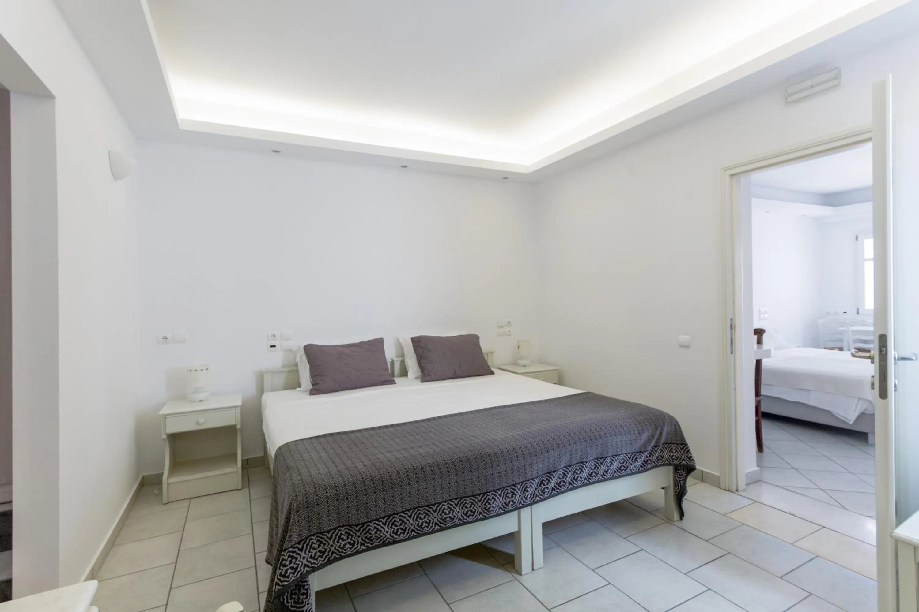 Bed in Alexandros Apartments