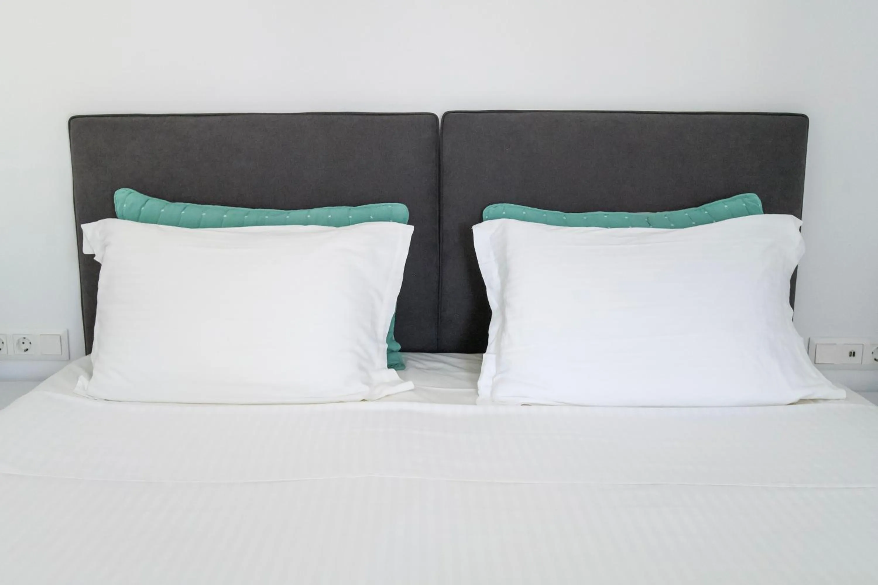 Bed in Alexandros Apartments