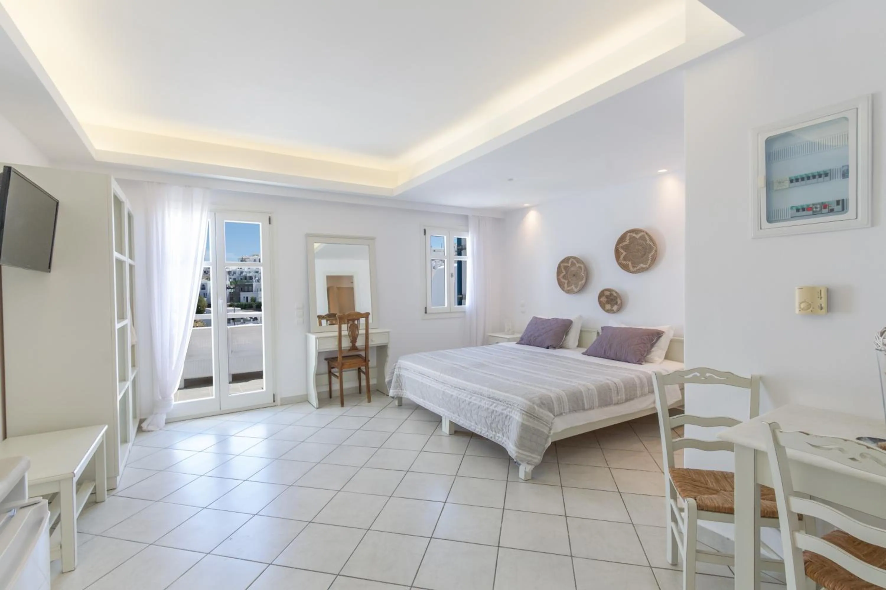 Bed in Alexandros Apartments