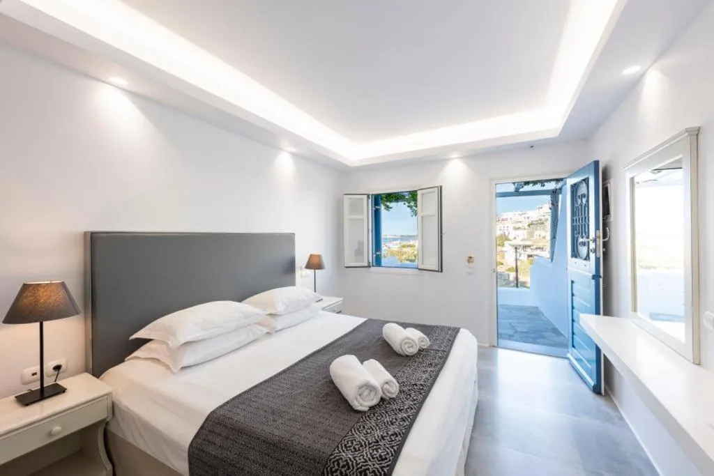 Bed in Alexandros Apartments