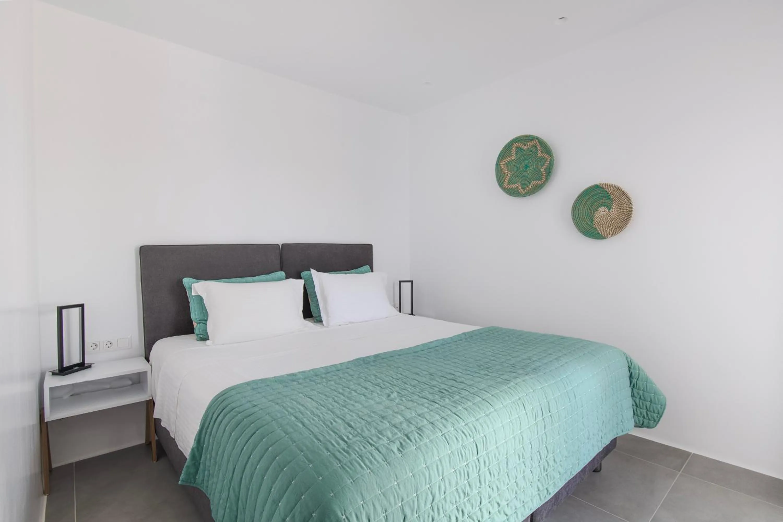 Bed in Alexandros Apartments