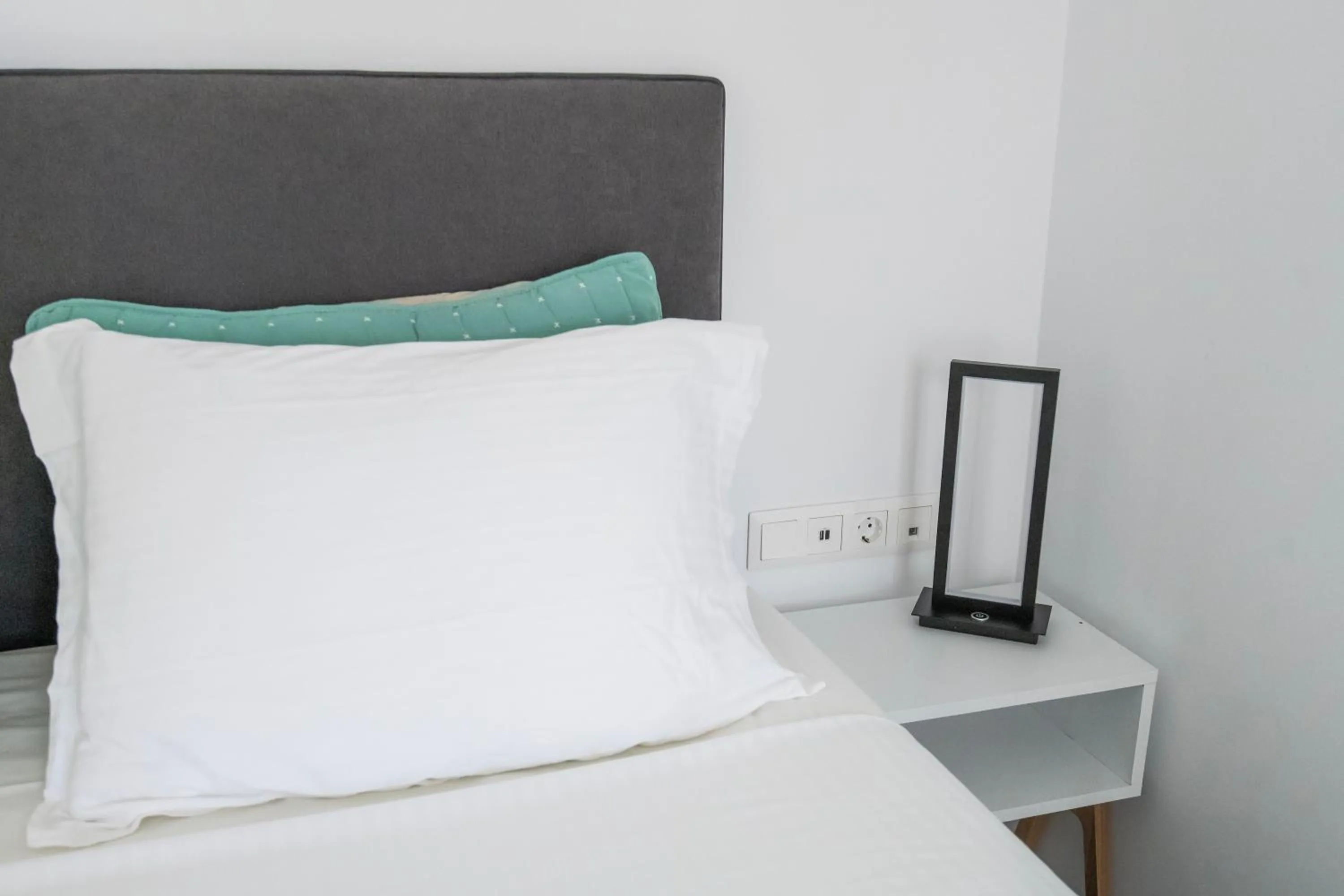 Bed in Alexandros Apartments