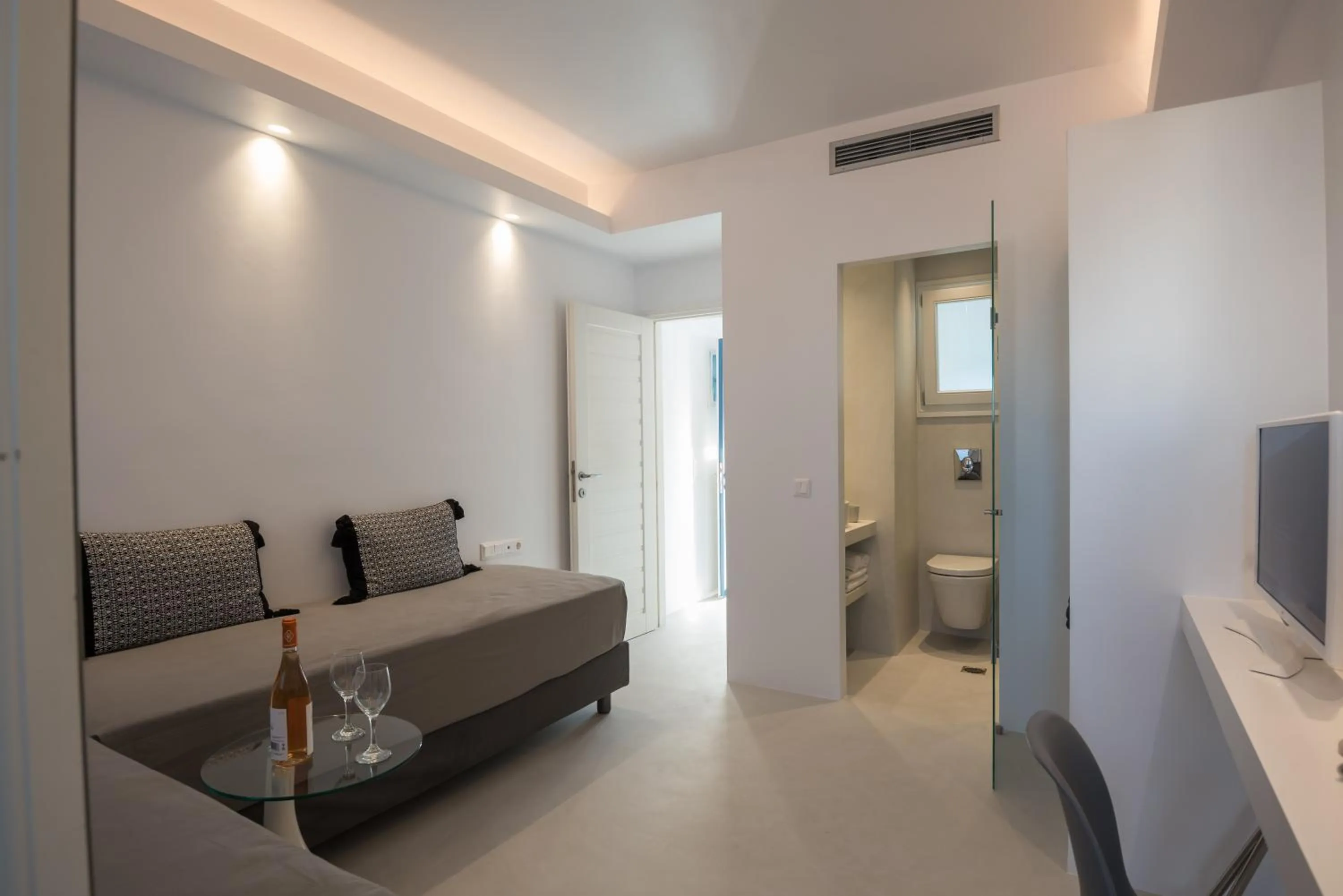 Bed in Alexandros Apartments