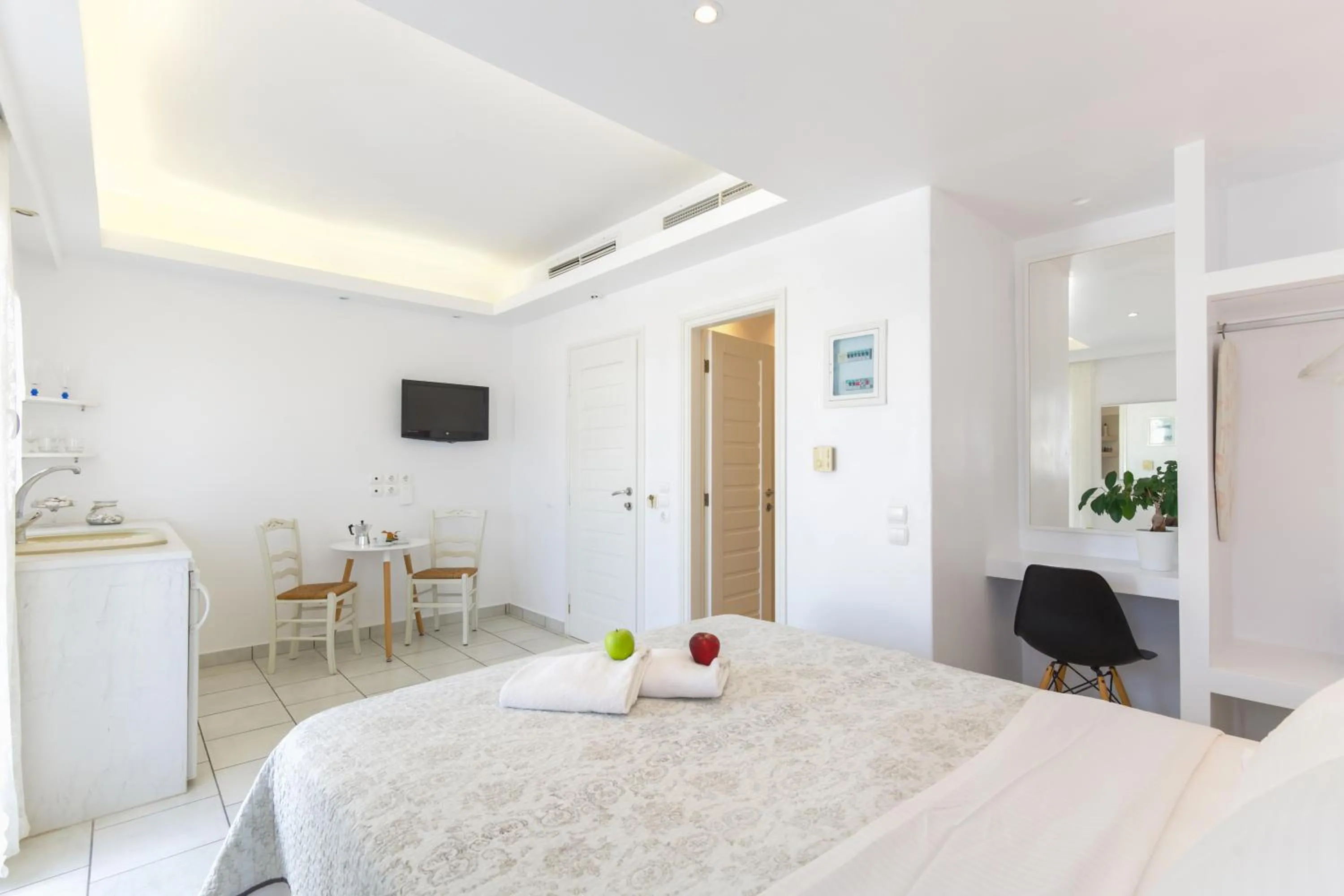 Bed in Alexandros Apartments