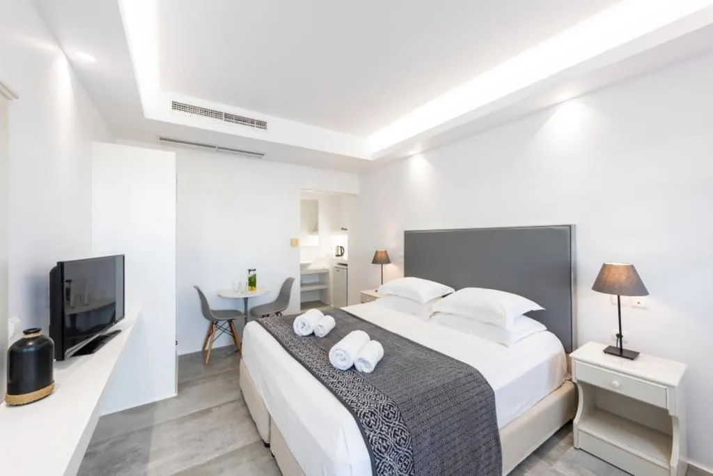 Bed in Alexandros Apartments