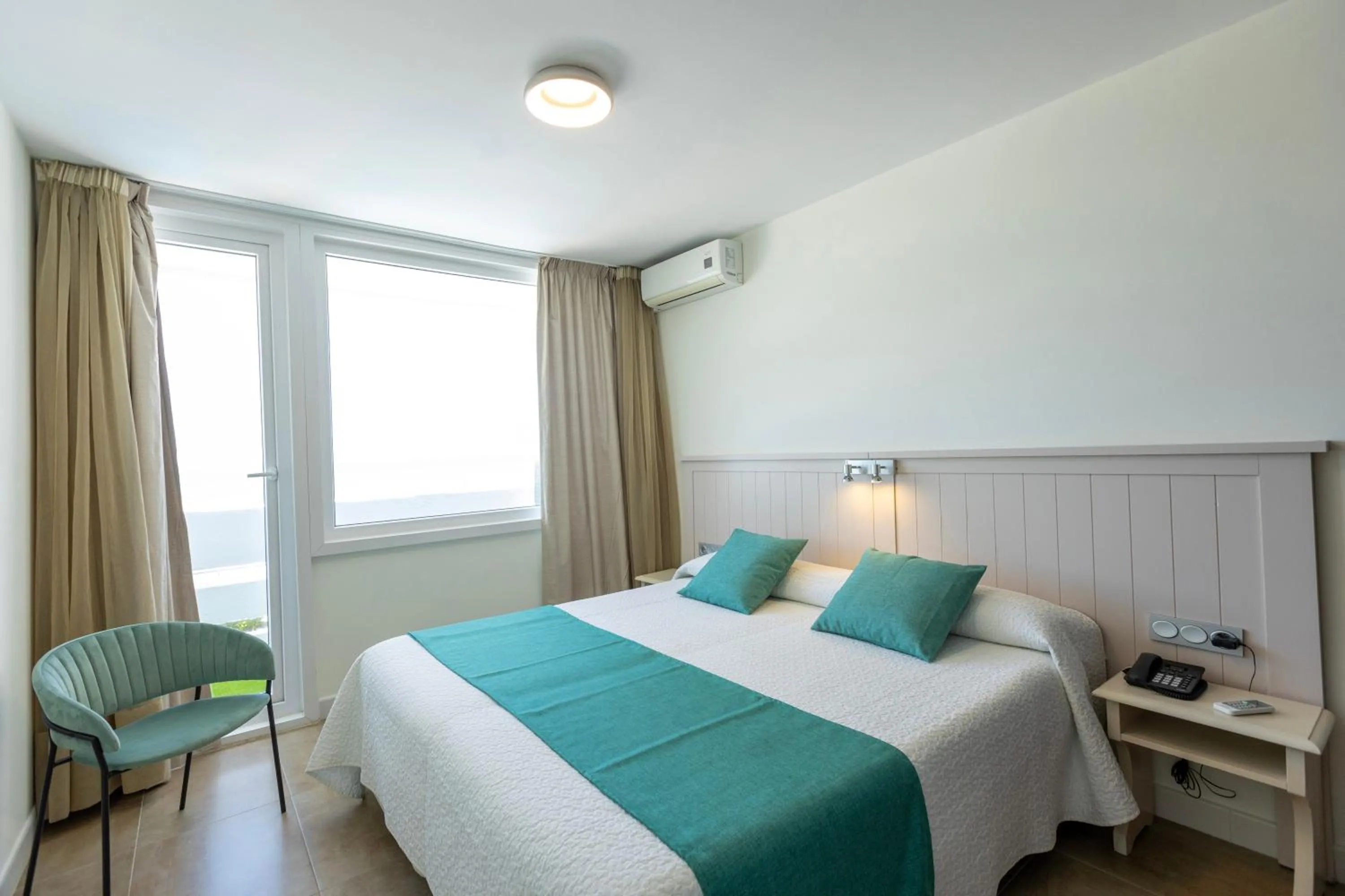 Bed in Hotel Flamero