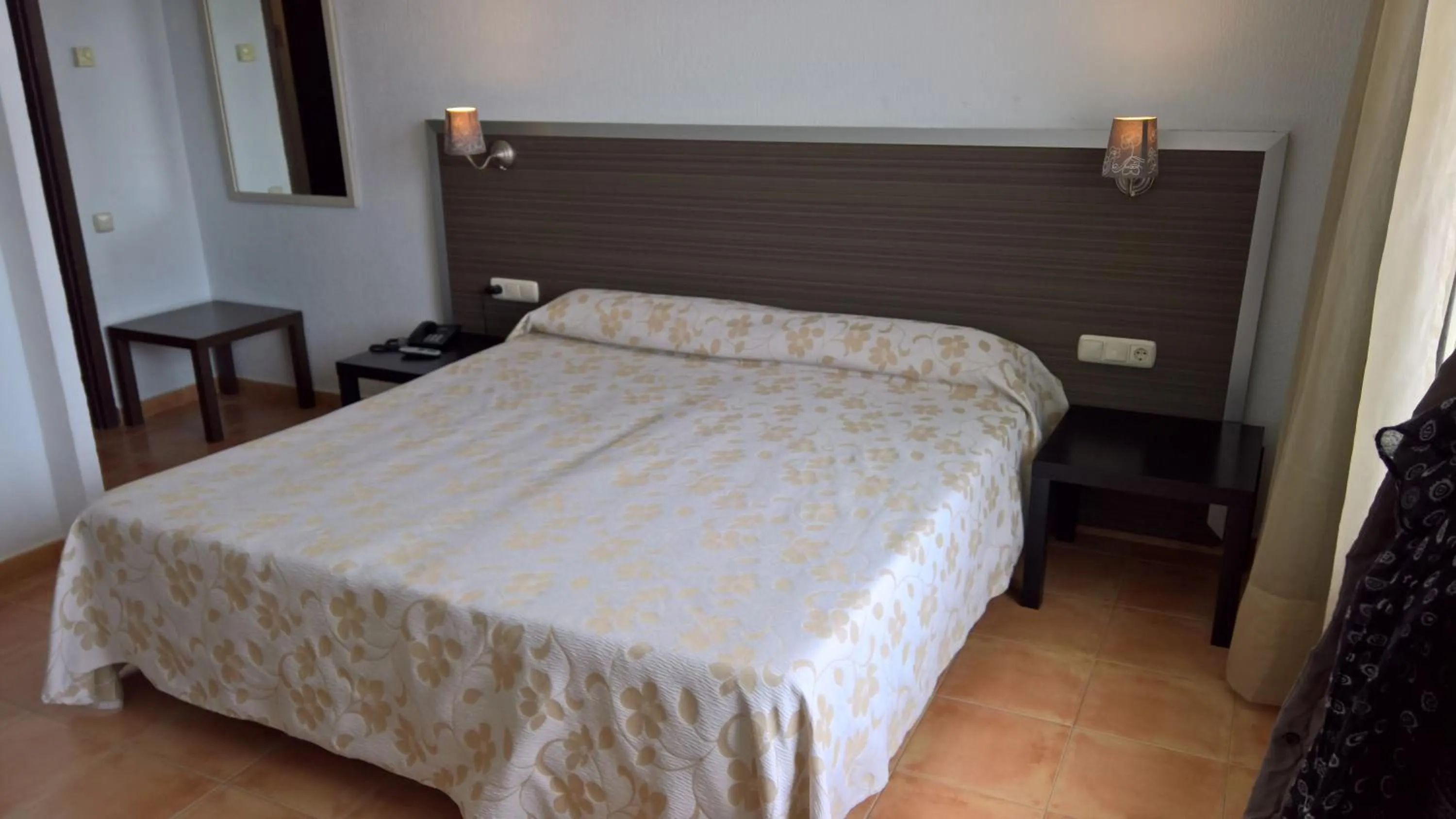 Bed in Hotel Flamero